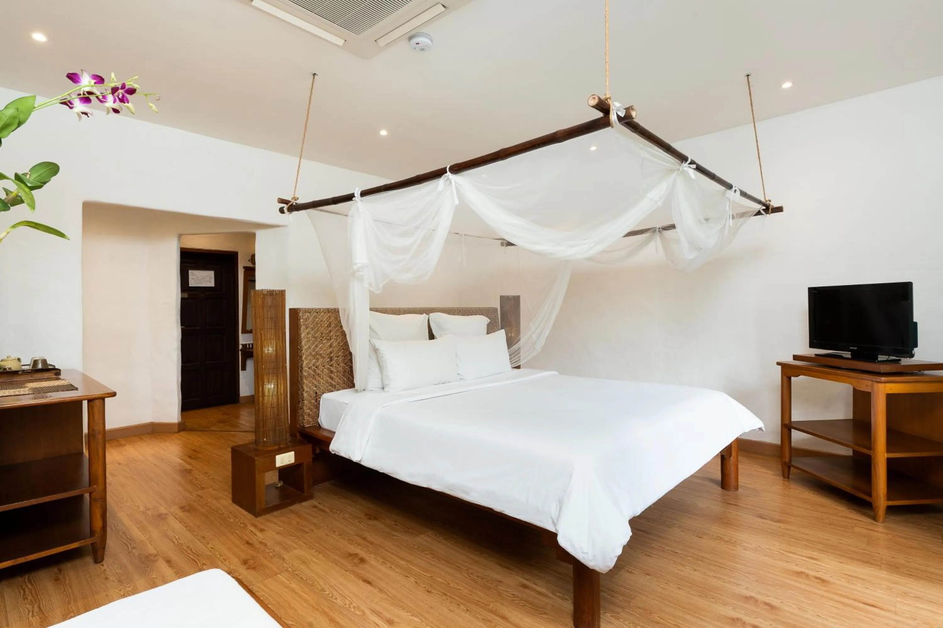 Bed in The Legend Chiang Rai Boutique River Resort & Spa