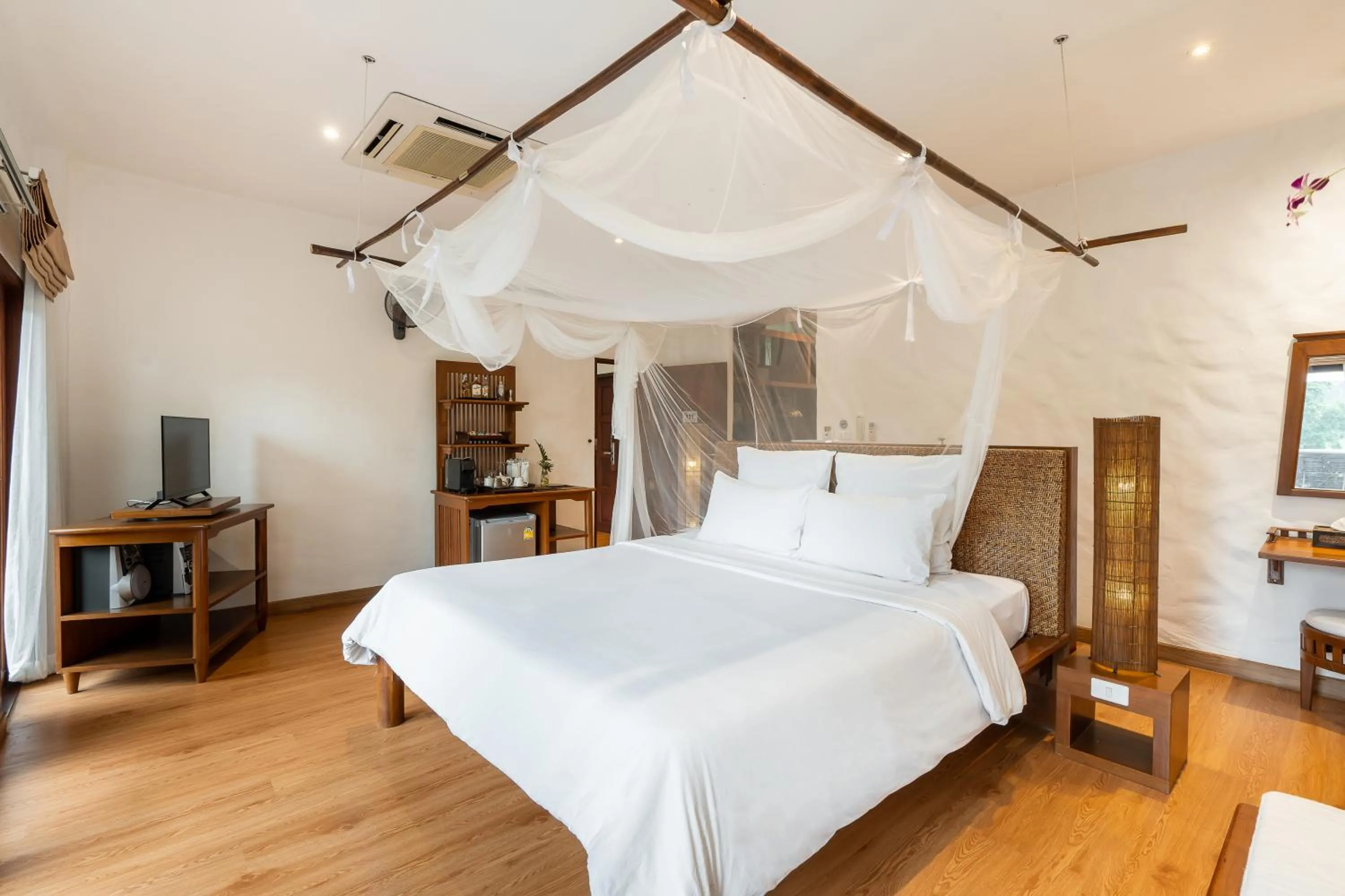 Bed in The Legend Chiang Rai Boutique River Resort & Spa