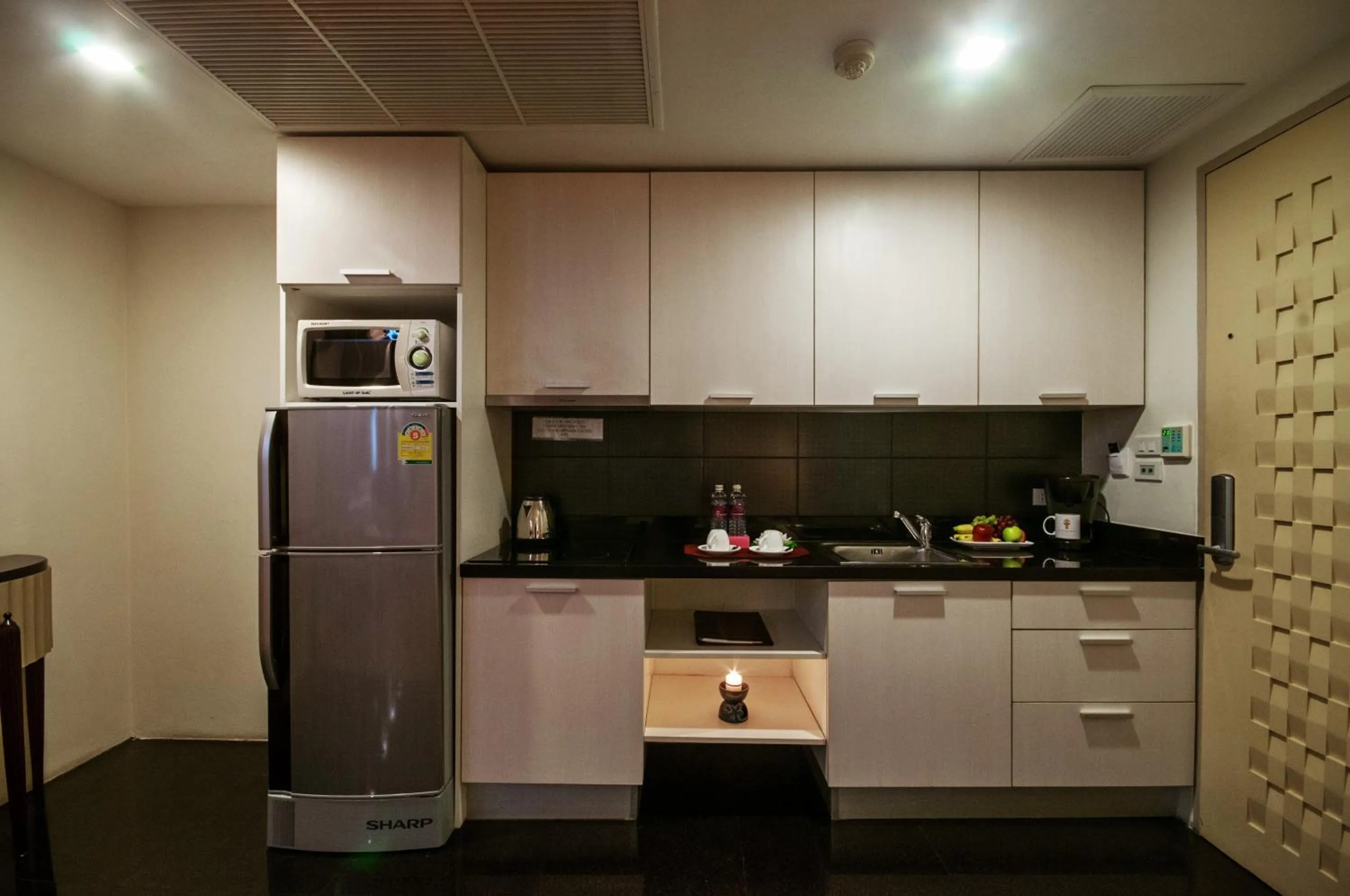 Kitchen or kitchenette in The Bless Hotel and Residence