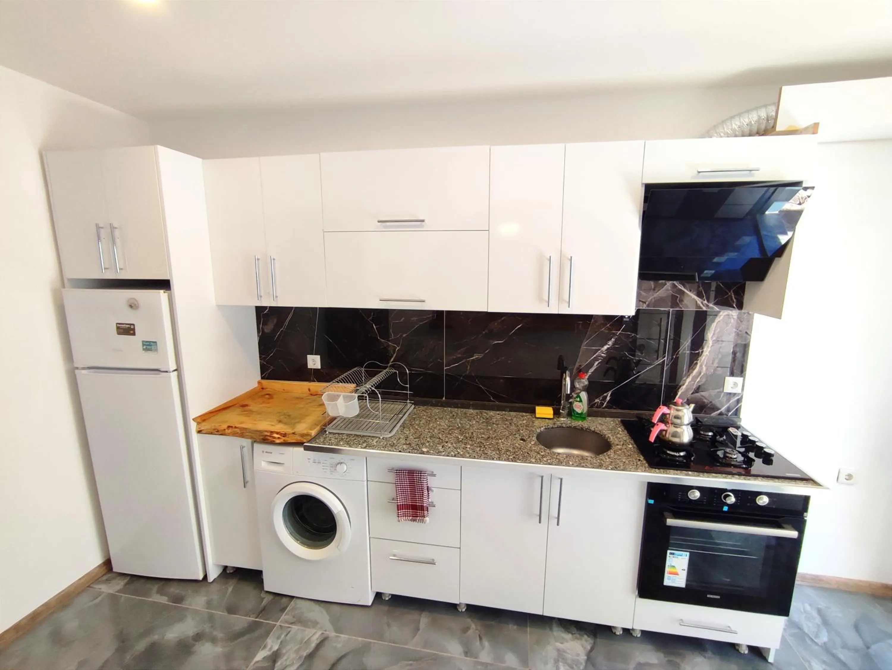 Kitchen or kitchenette in Likya SUP Apart