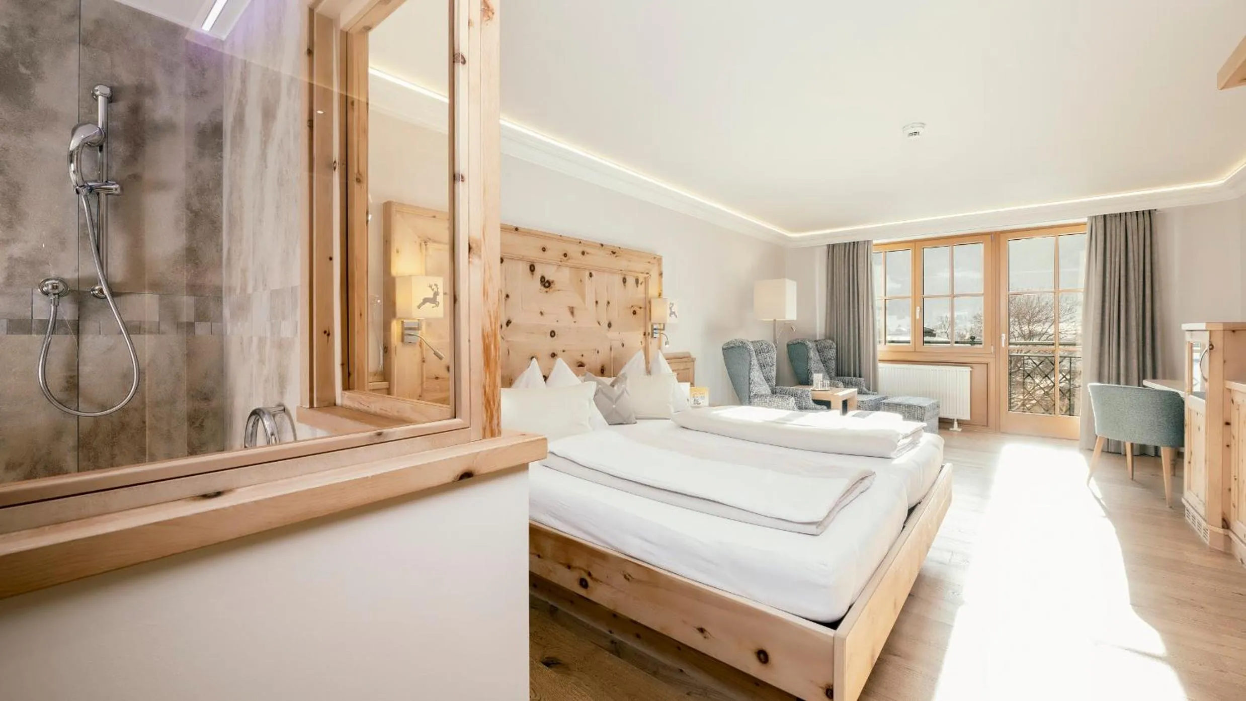 Seating area, Bed in Wellnesshotel Eggerwirt