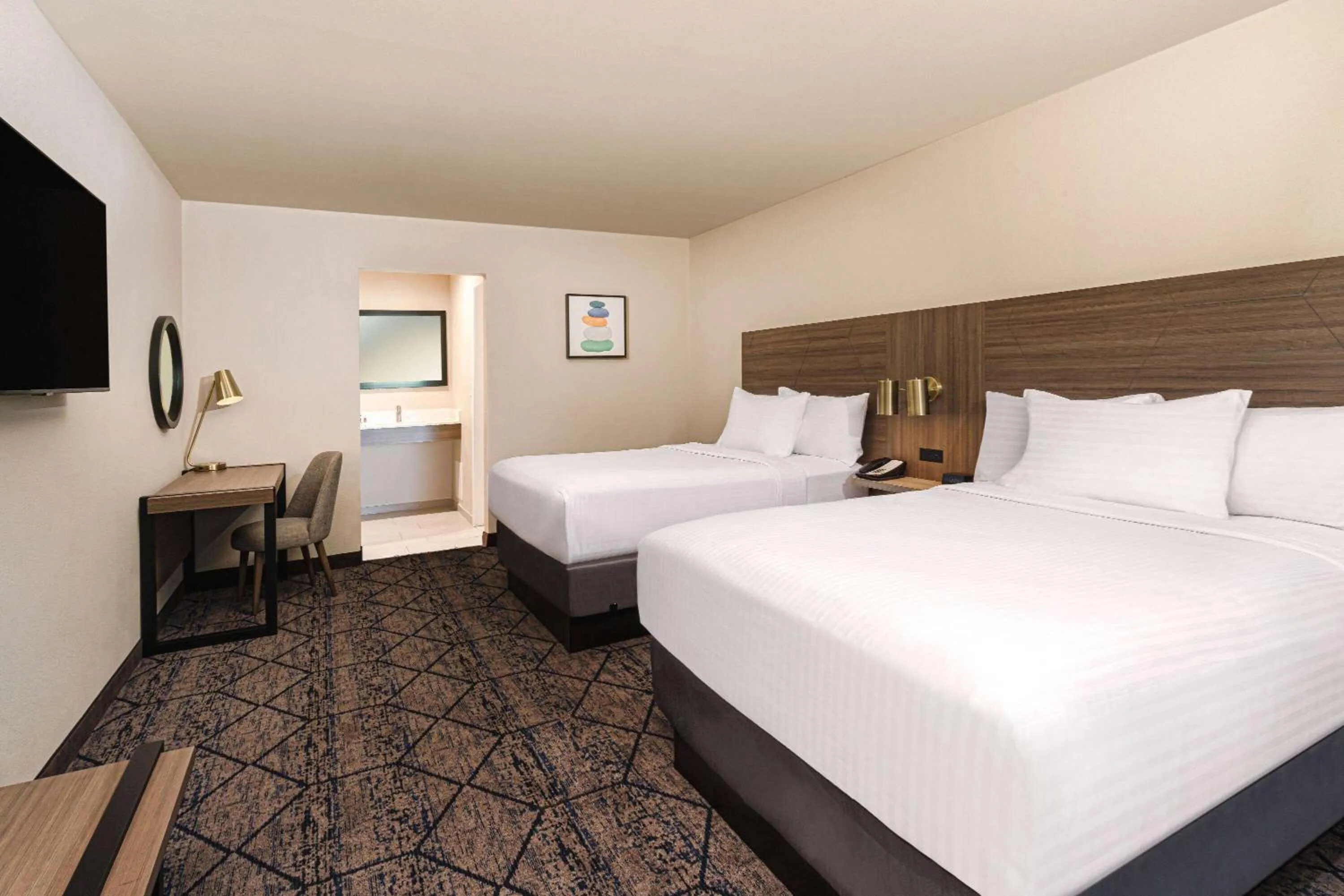Photo of the whole room, Bed in Ramada by Wyndham Modesto Yosemite Area