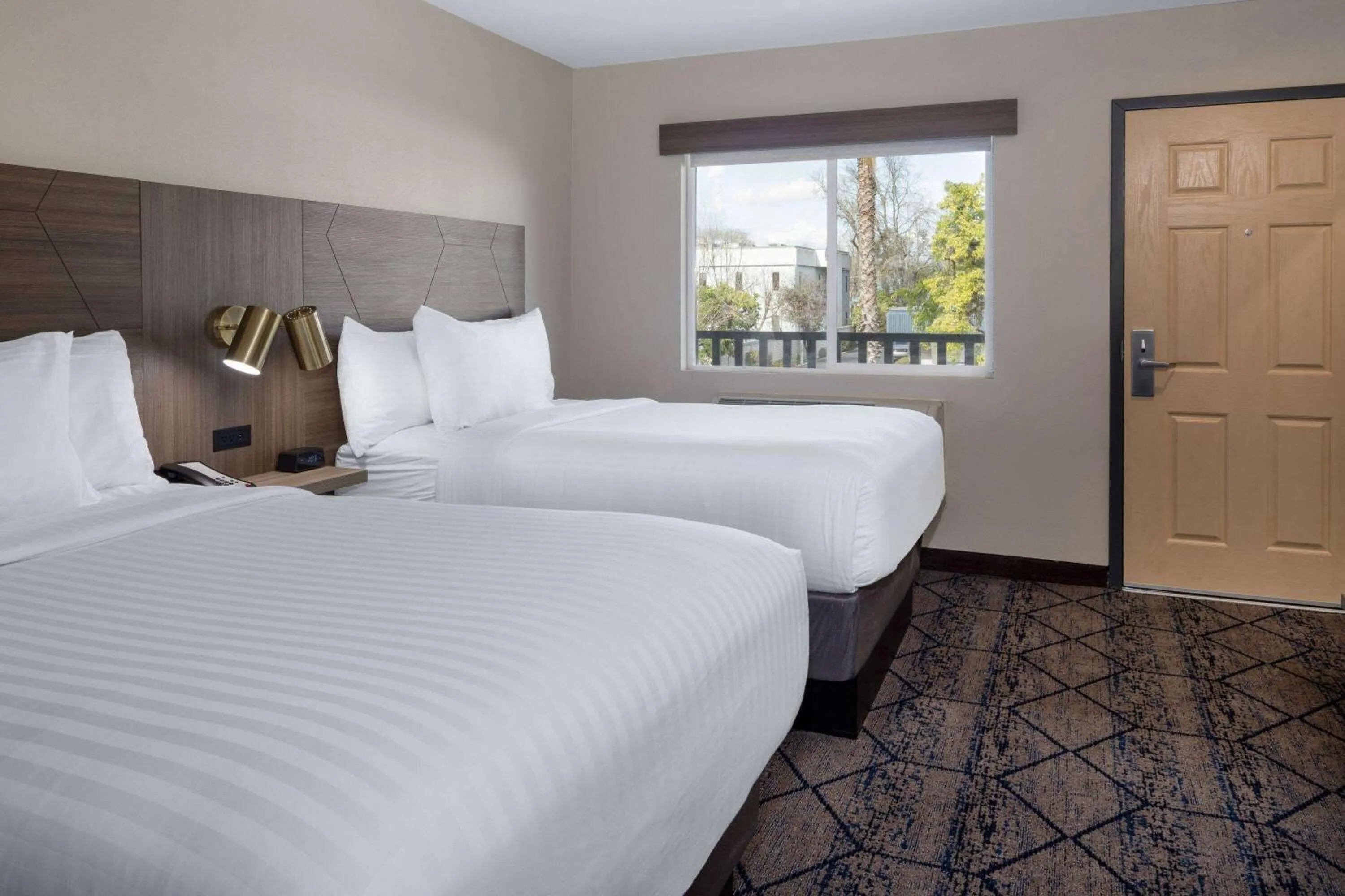 Photo of the whole room, Bed in Ramada by Wyndham Modesto Yosemite Area