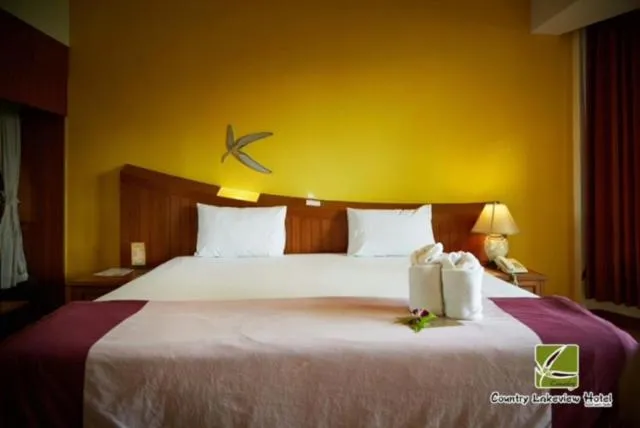 Bed in Country Lake View Hotel