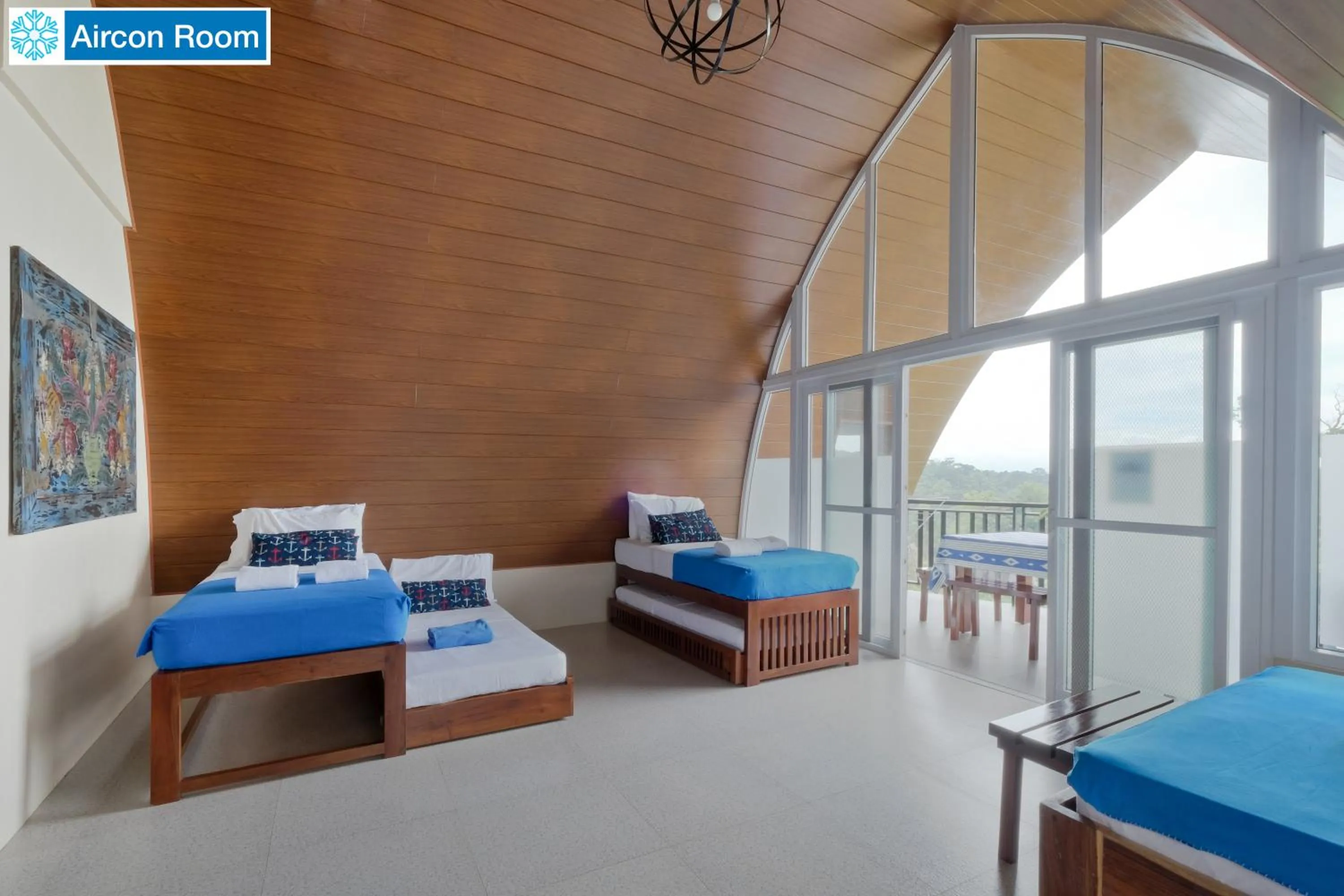 Bed in The Duyan House at Sinagtala Resort