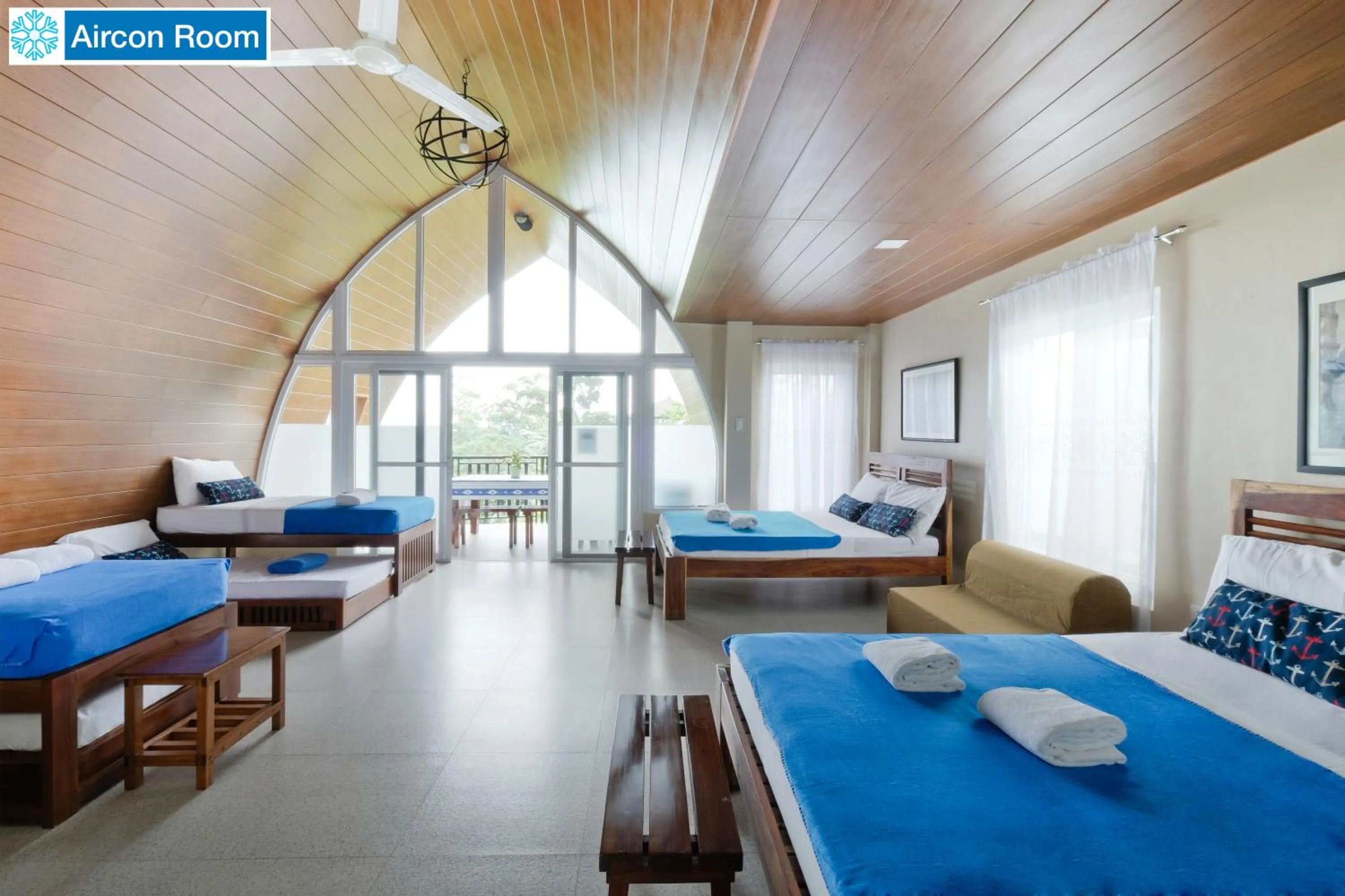 Bed in The Duyan House at Sinagtala Resort