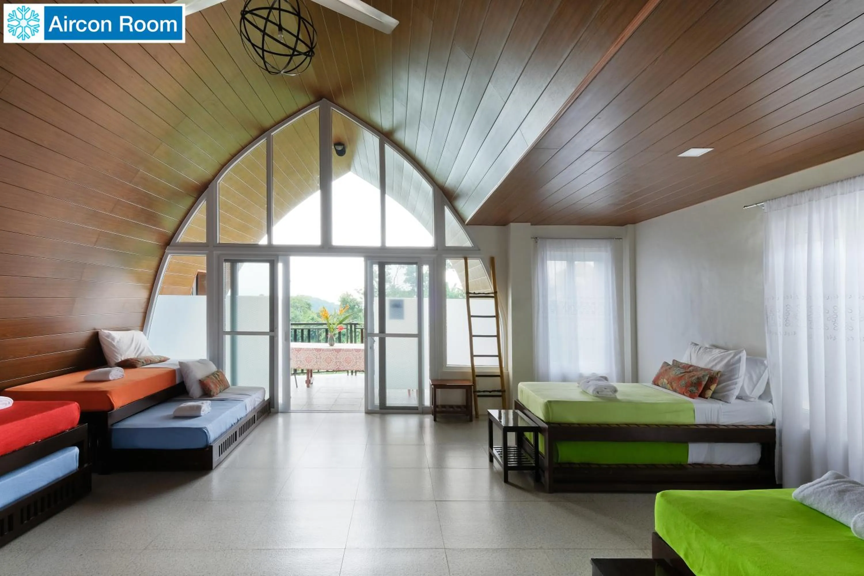 Bed in The Duyan House at Sinagtala Resort