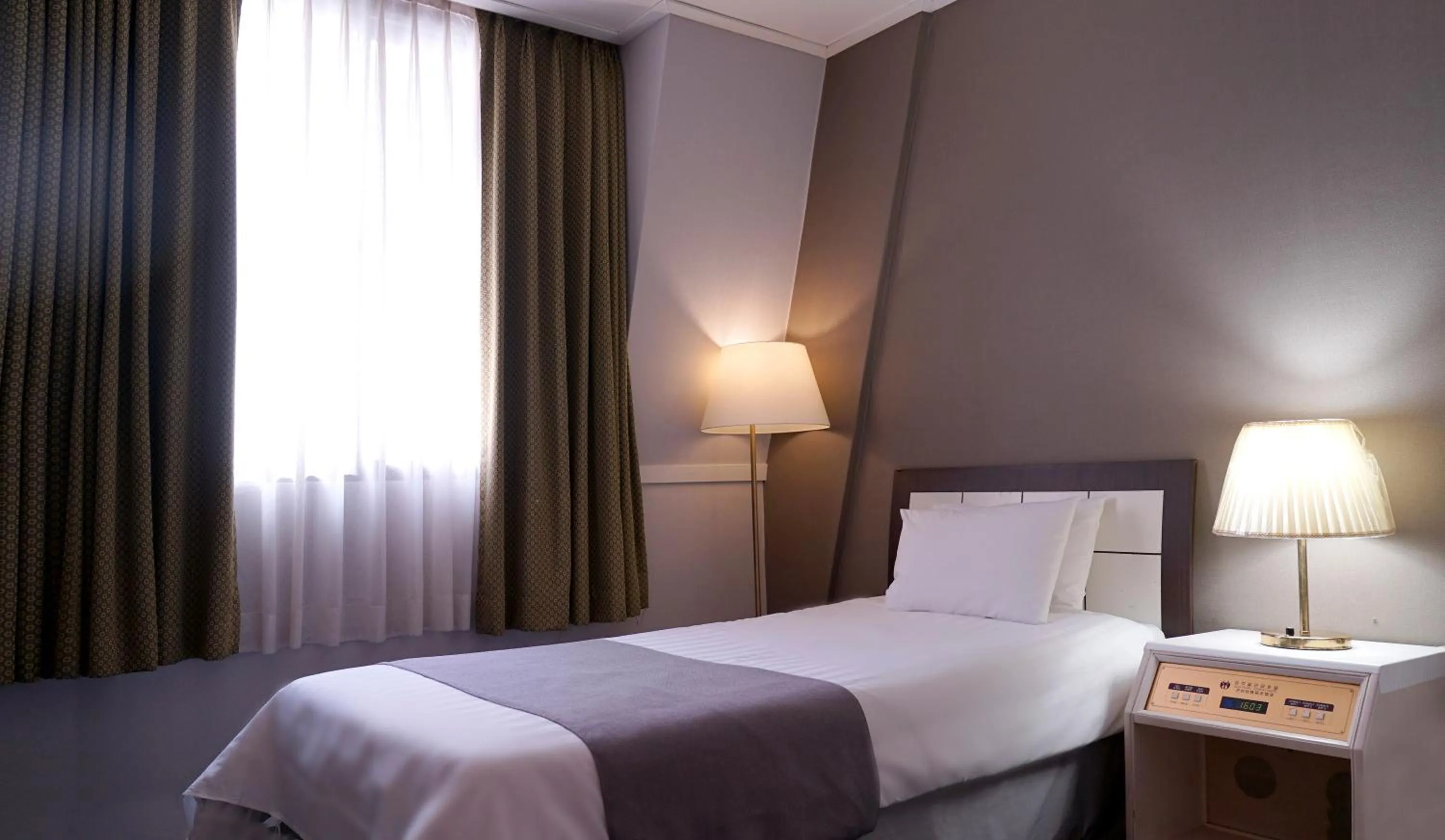 Bed in Pearl Hotel Jeju