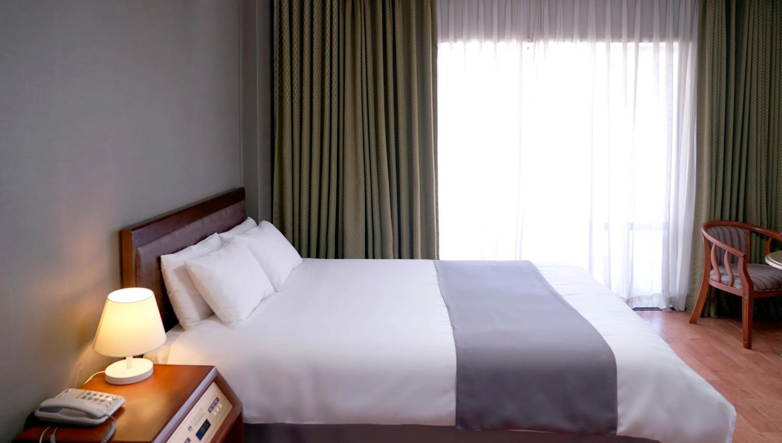 Bed in Pearl Hotel Jeju