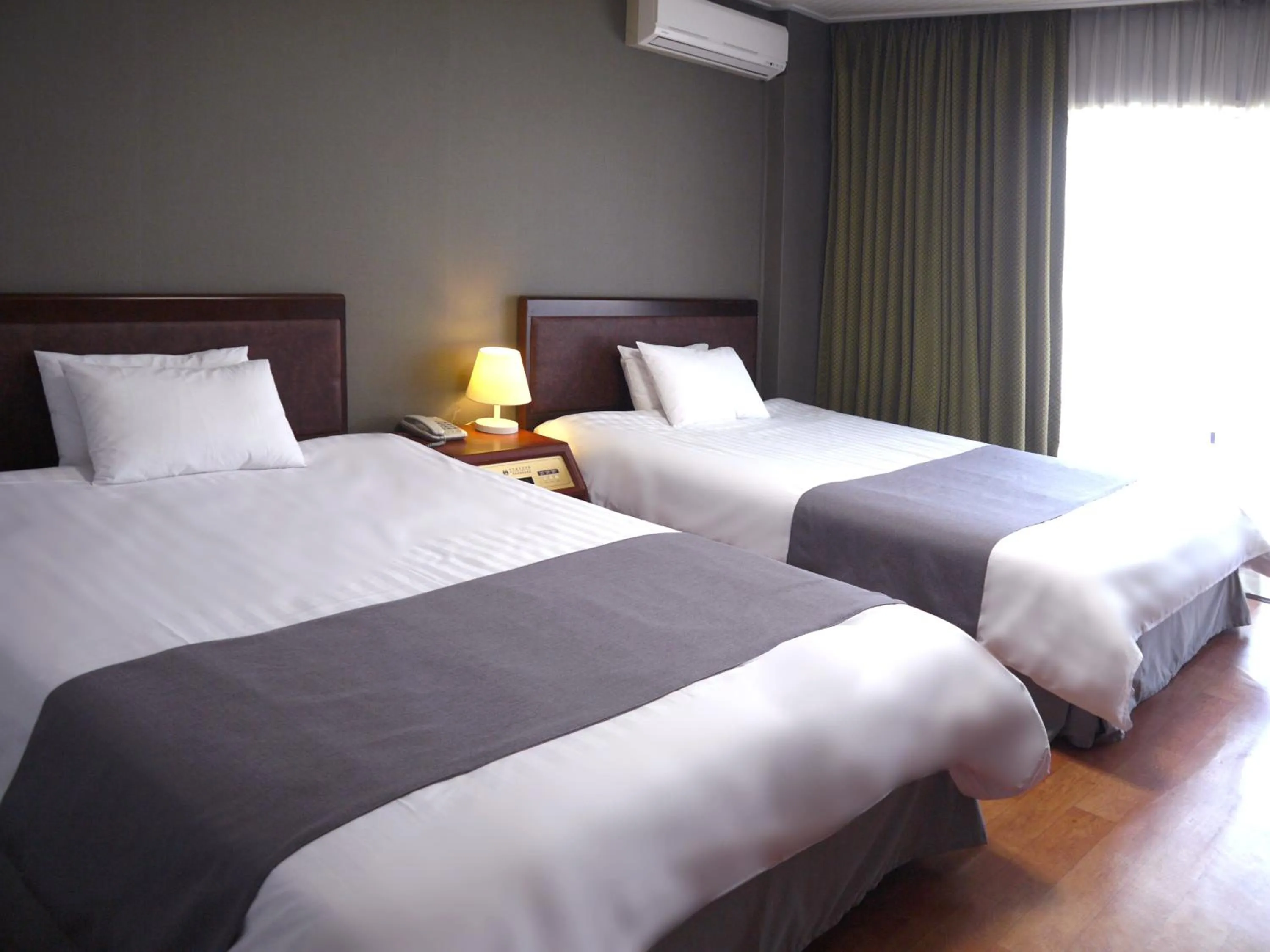 Bed in Pearl Hotel Jeju