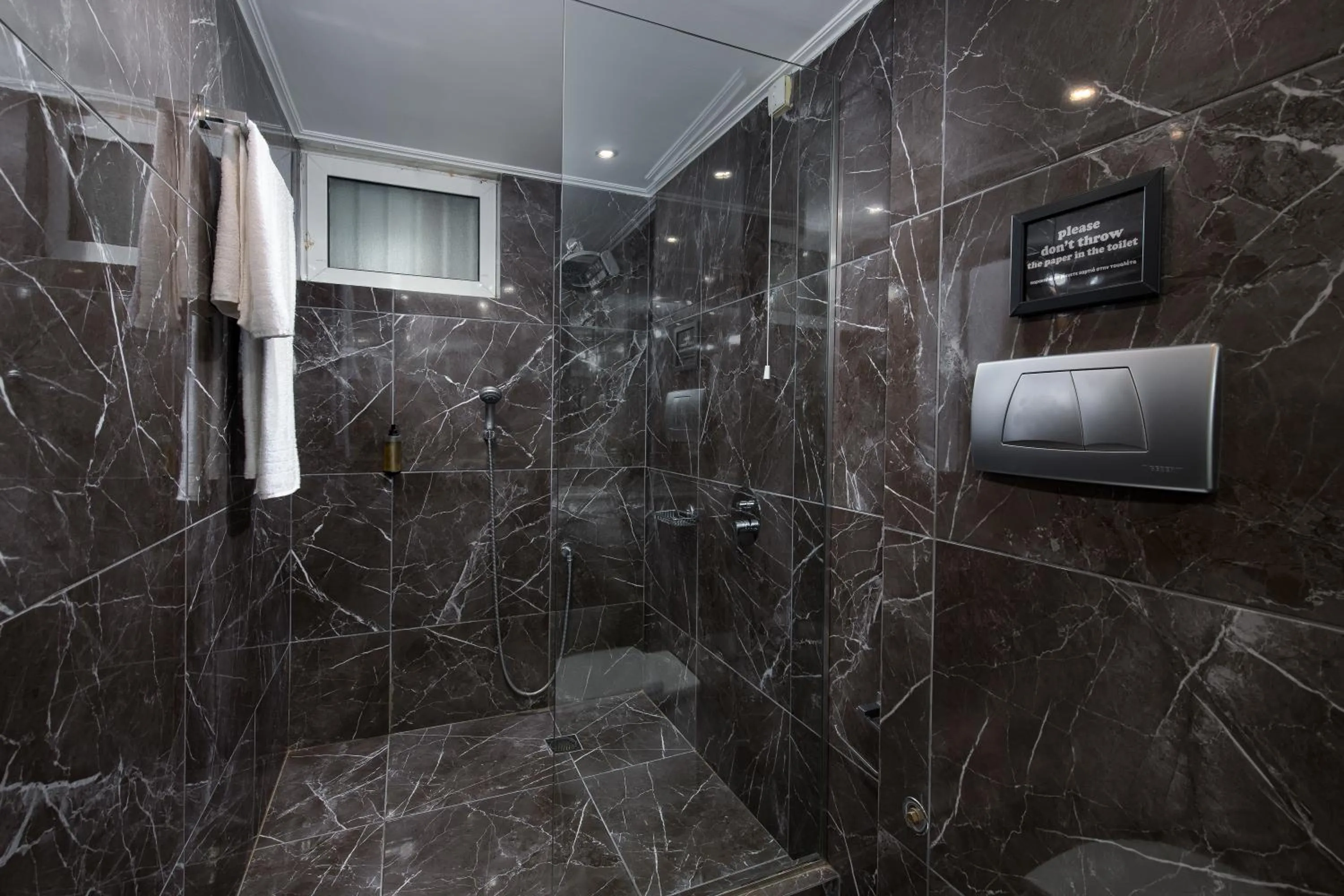 Shower in Athenian Riviera Hotel& Suites