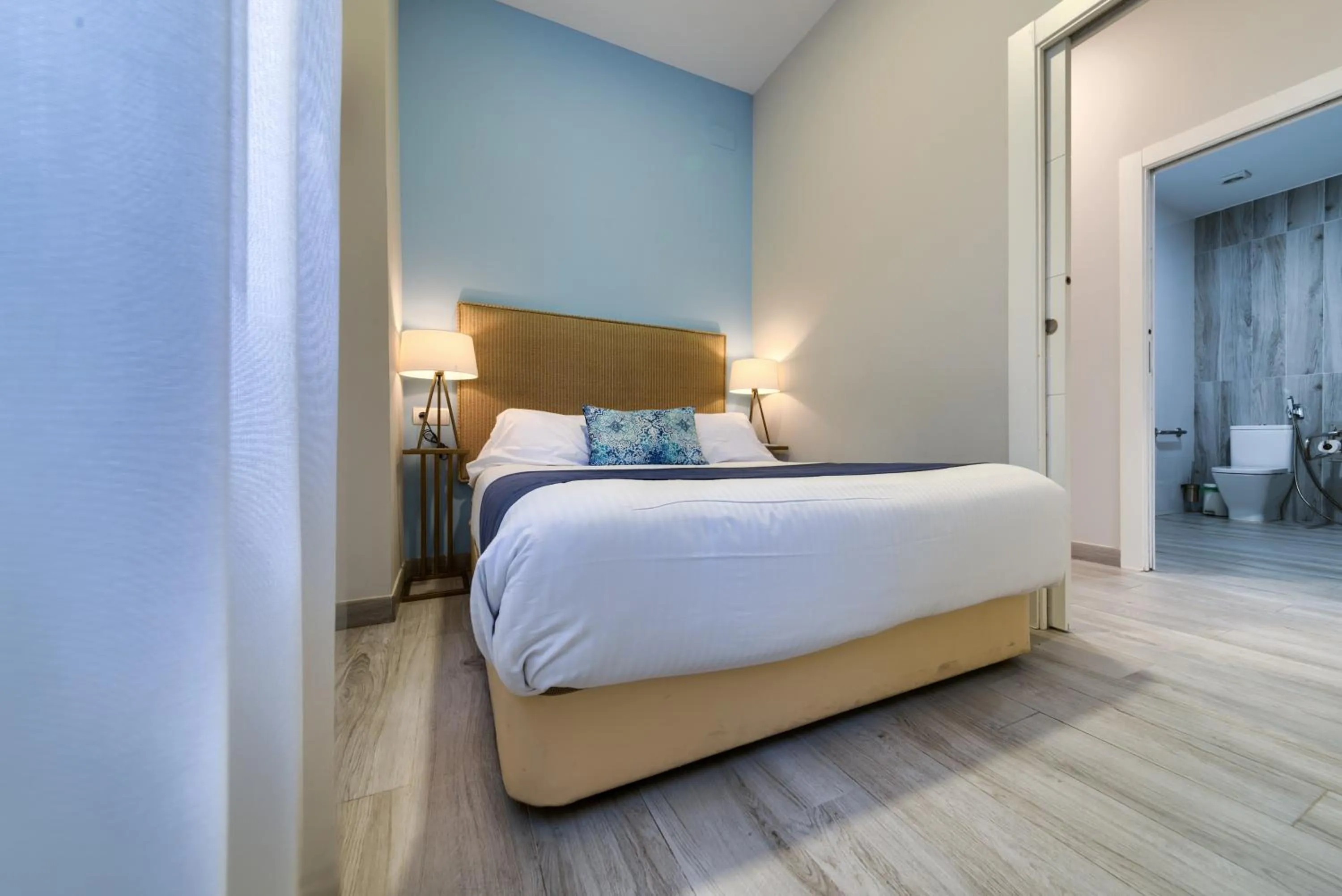 Bed in Holidays2Malaga Suites