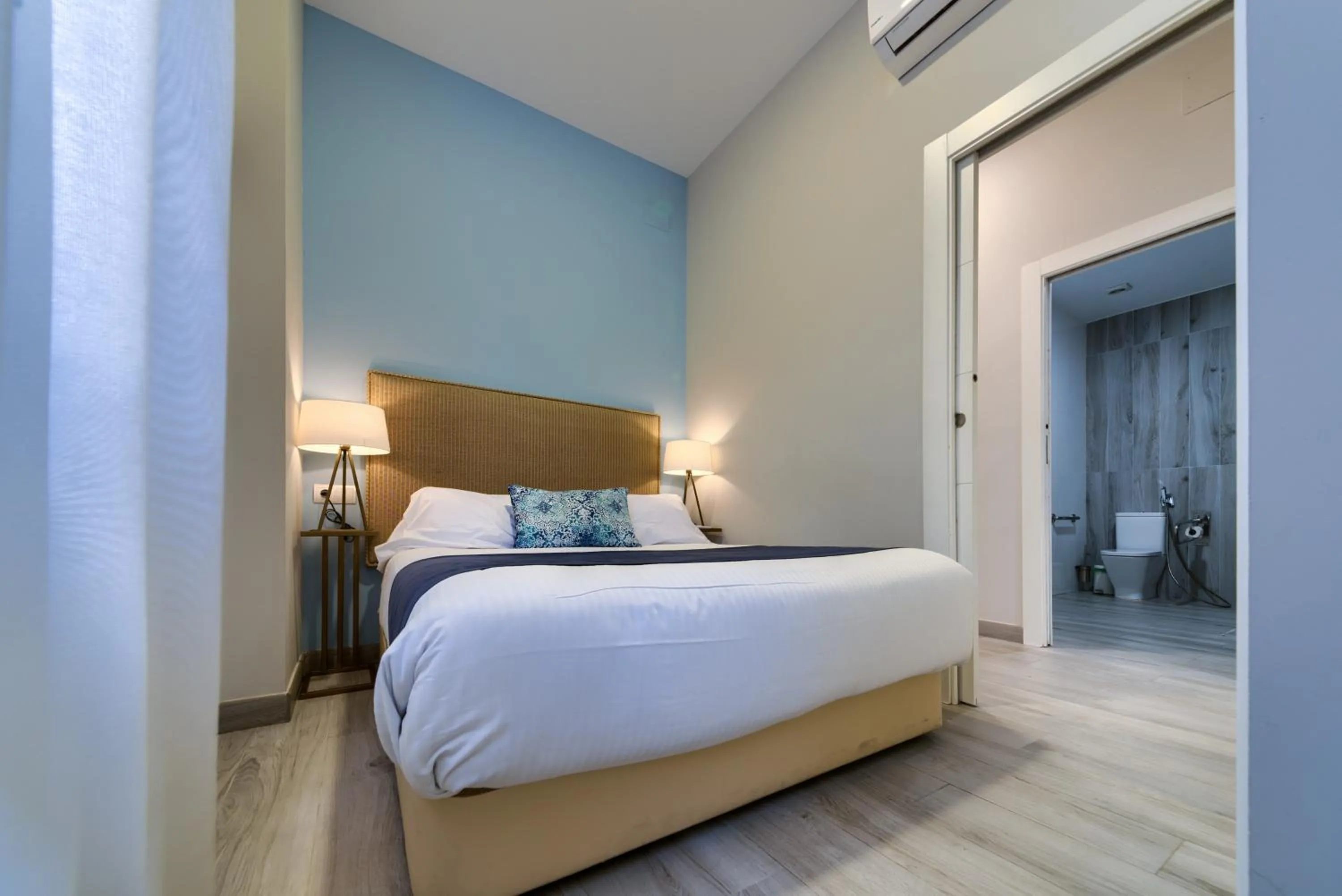 Bed in Holidays2Malaga Suites