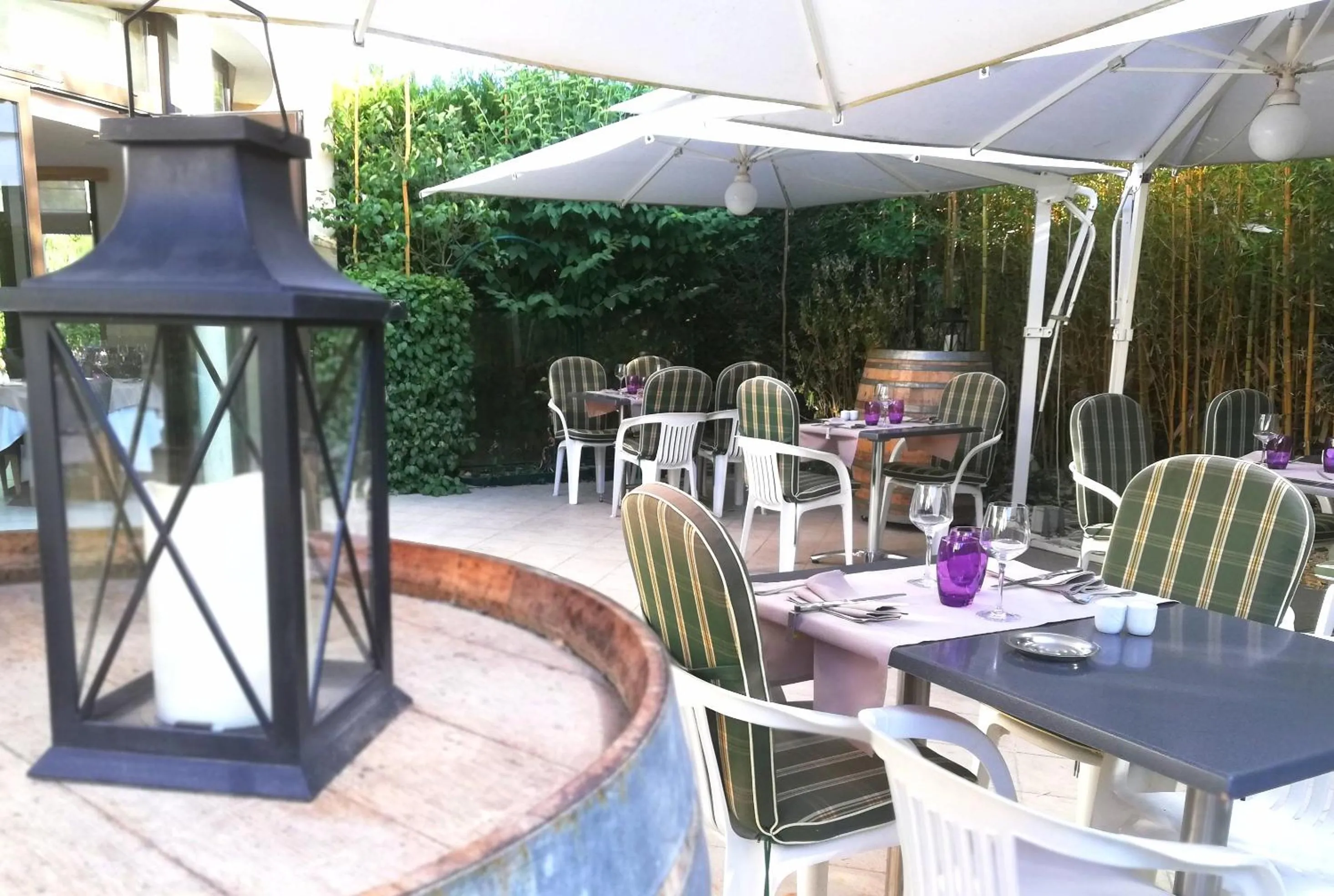 Patio in Logis Hotel Restaurant l'Orée Des Bois