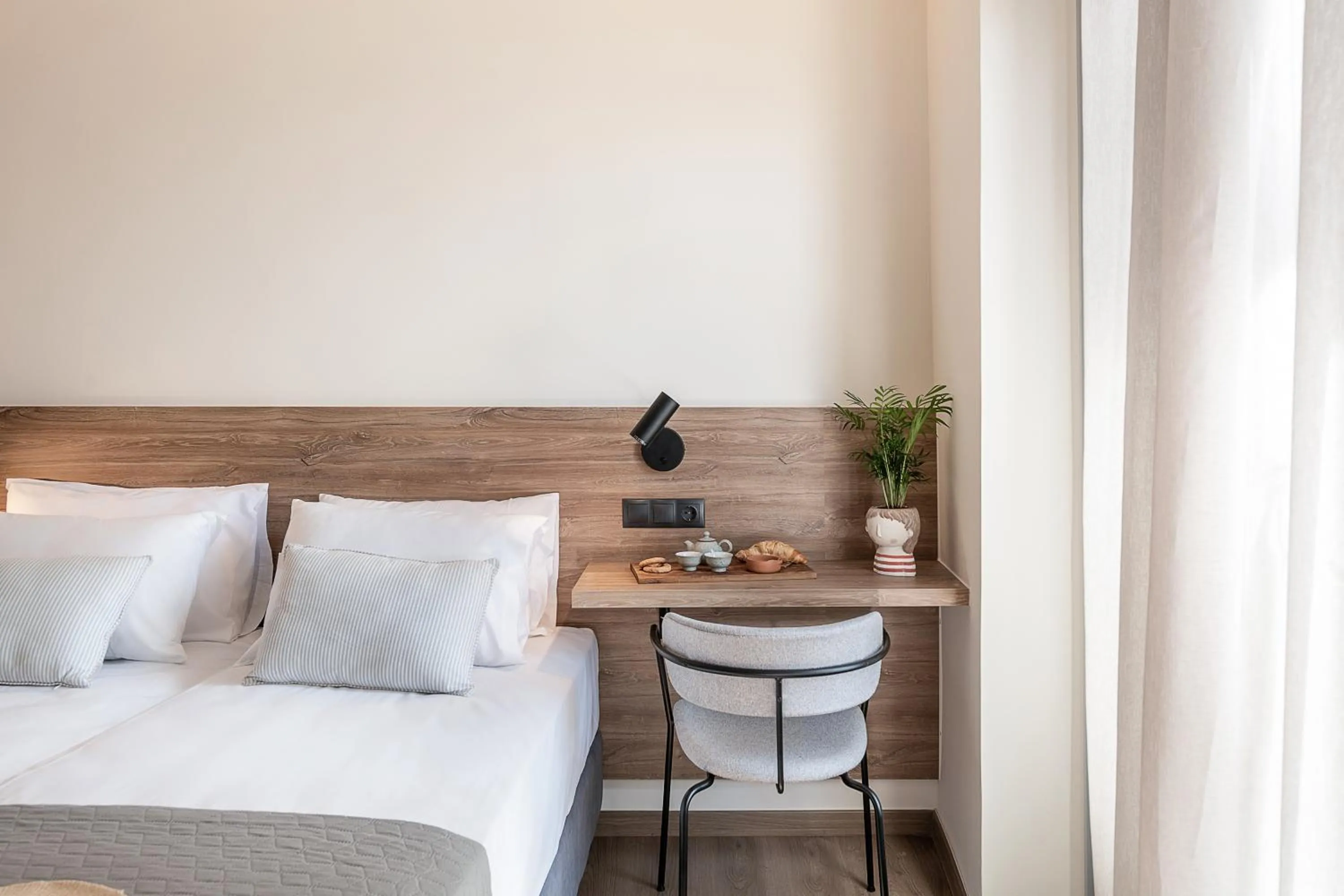 Bed in Amphitrite Hotel