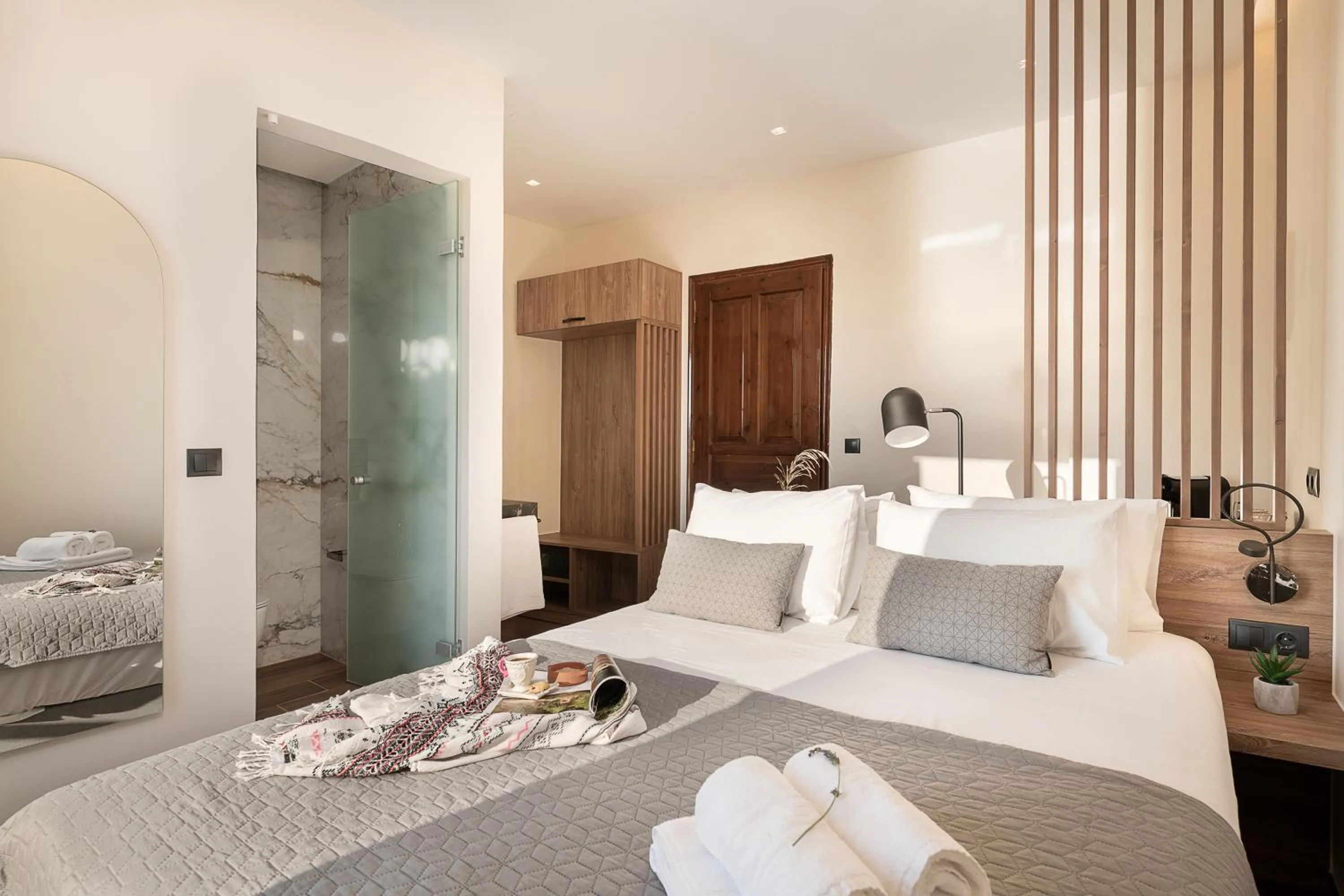 Bed in Amphitrite Hotel