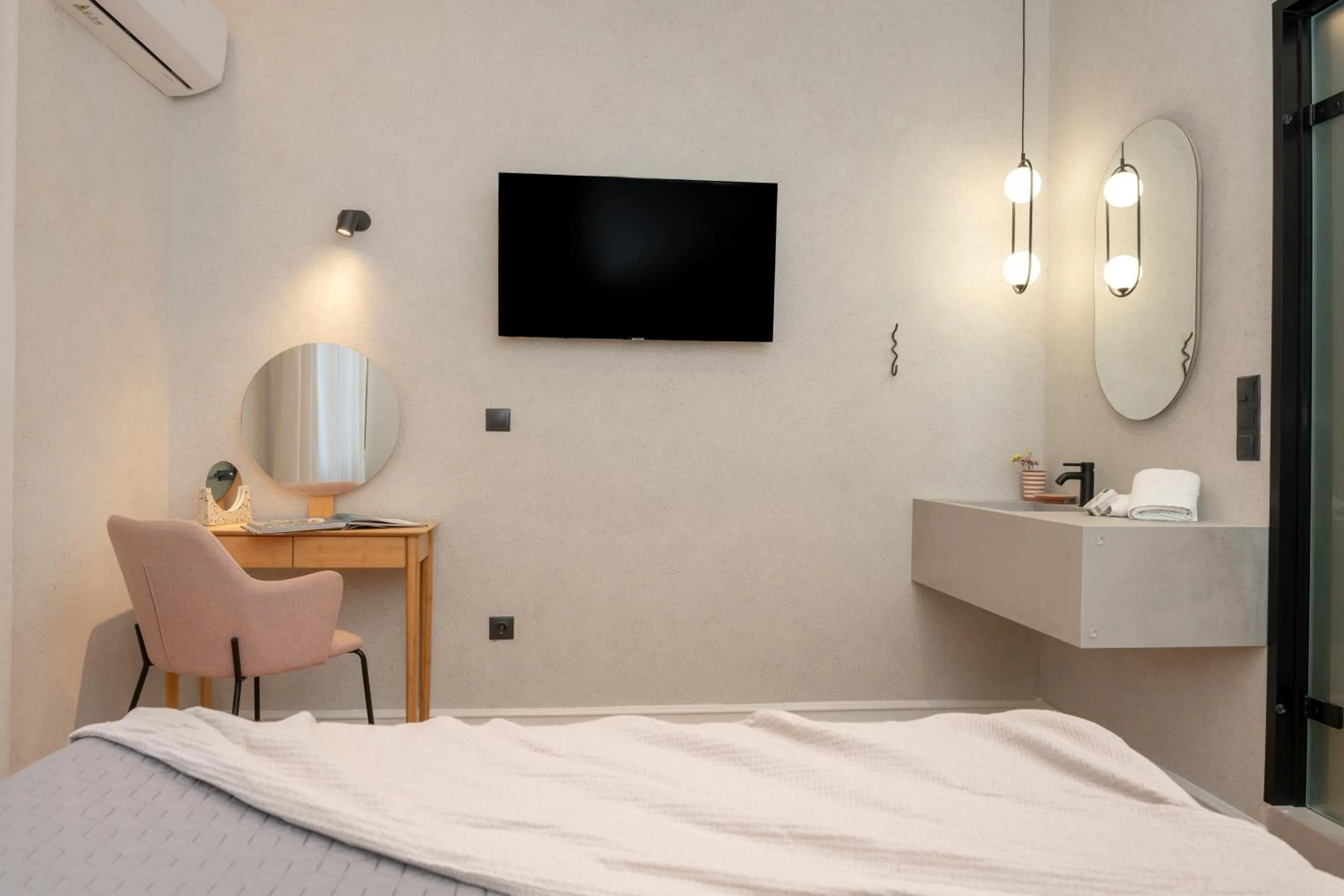 Bed in Amphitrite Hotel