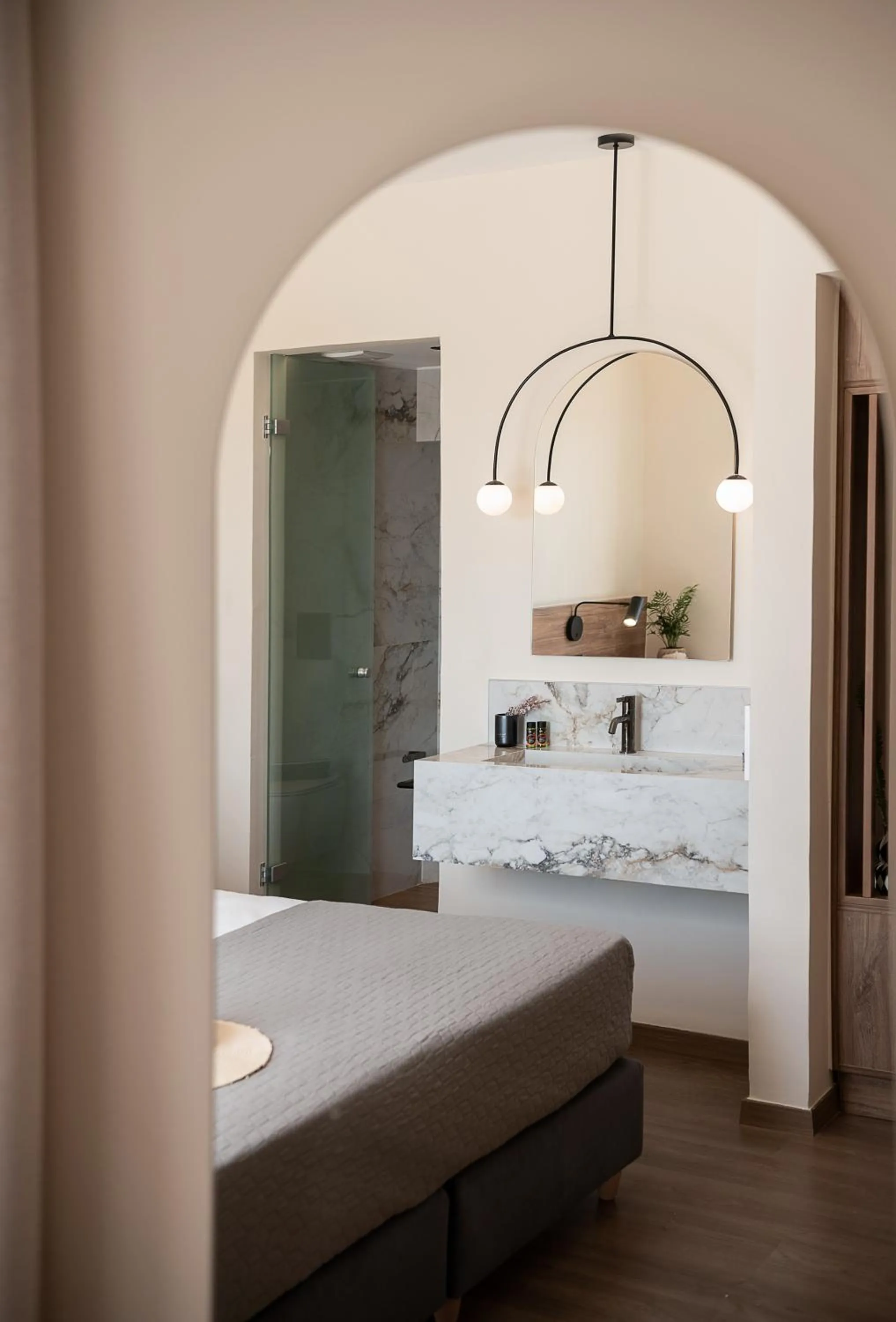 Bed in Amphitrite Hotel