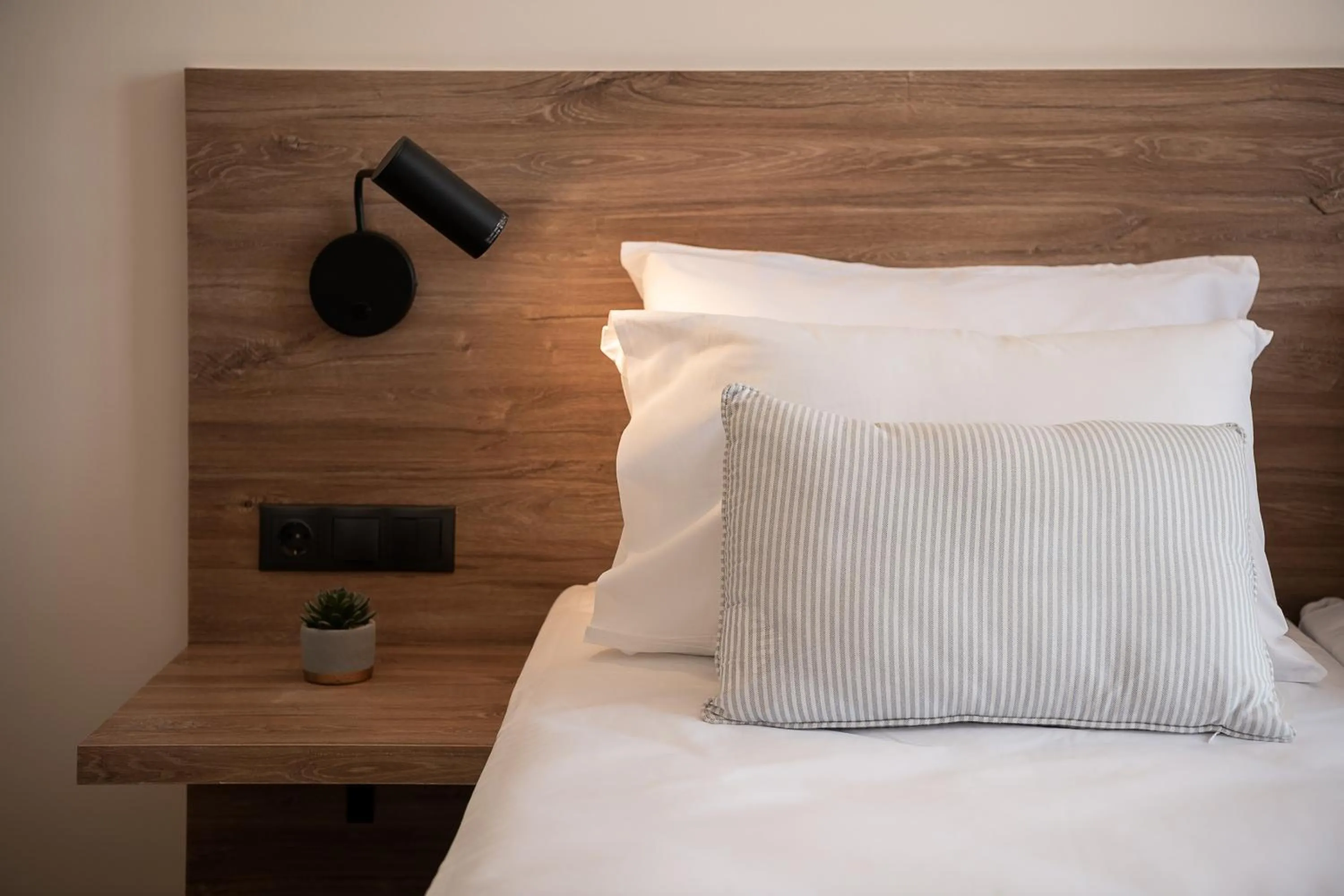 Bed in Amphitrite Hotel