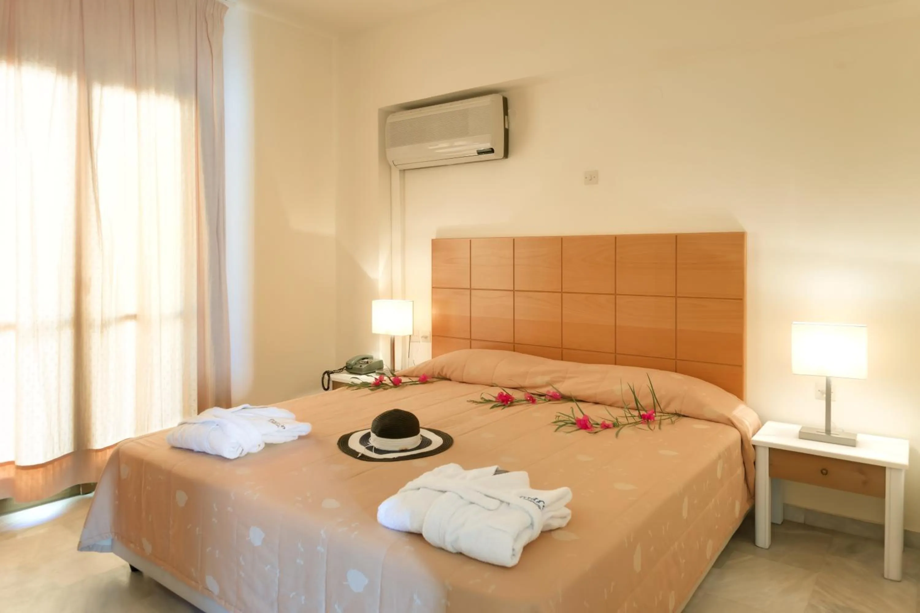 Bed in Mare Hotel Apartments