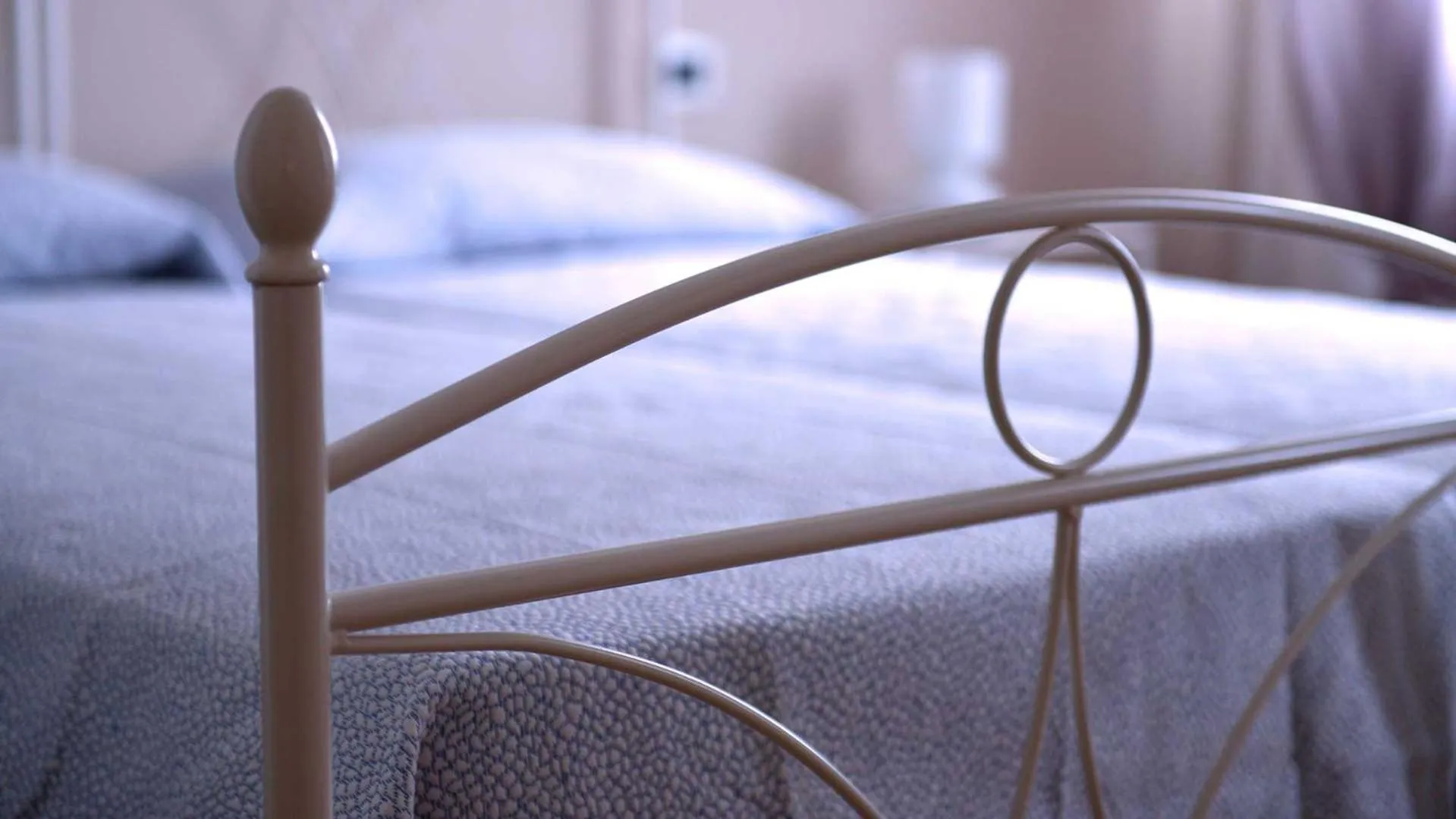 Bed in La Locanda Francigena