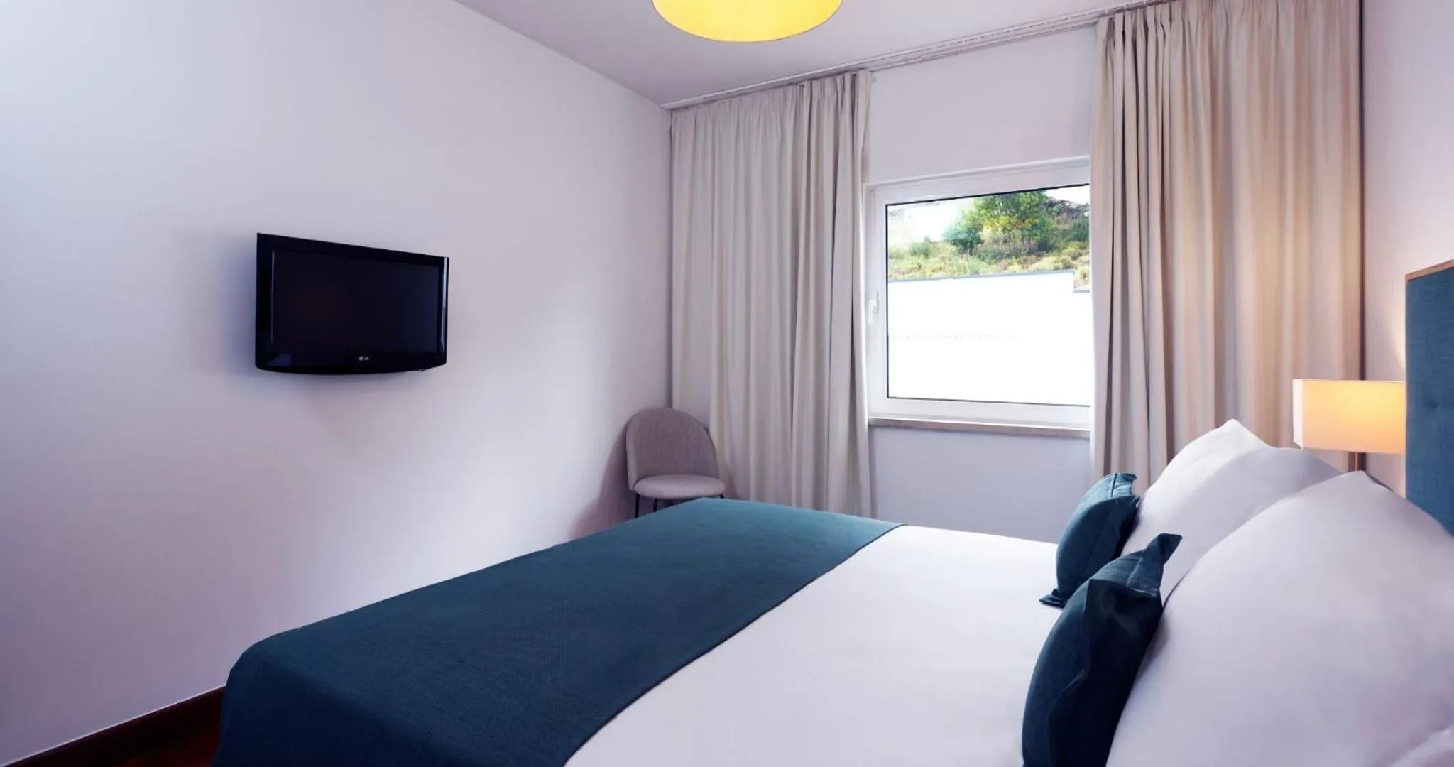 Bed in Montebelo Aguieira Lake Resort & Spa