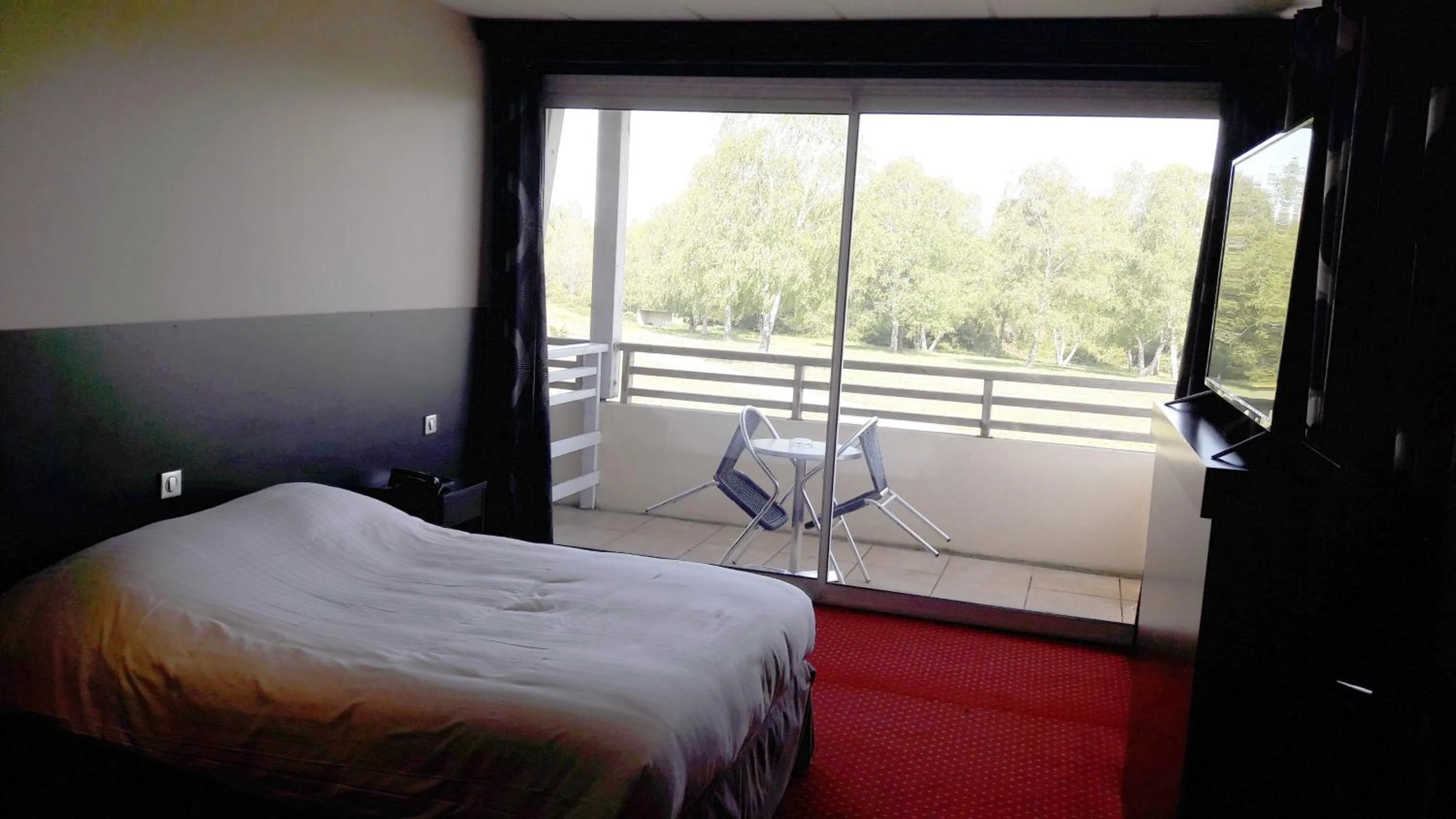 Bed in Hôtel du Casino de Capvern