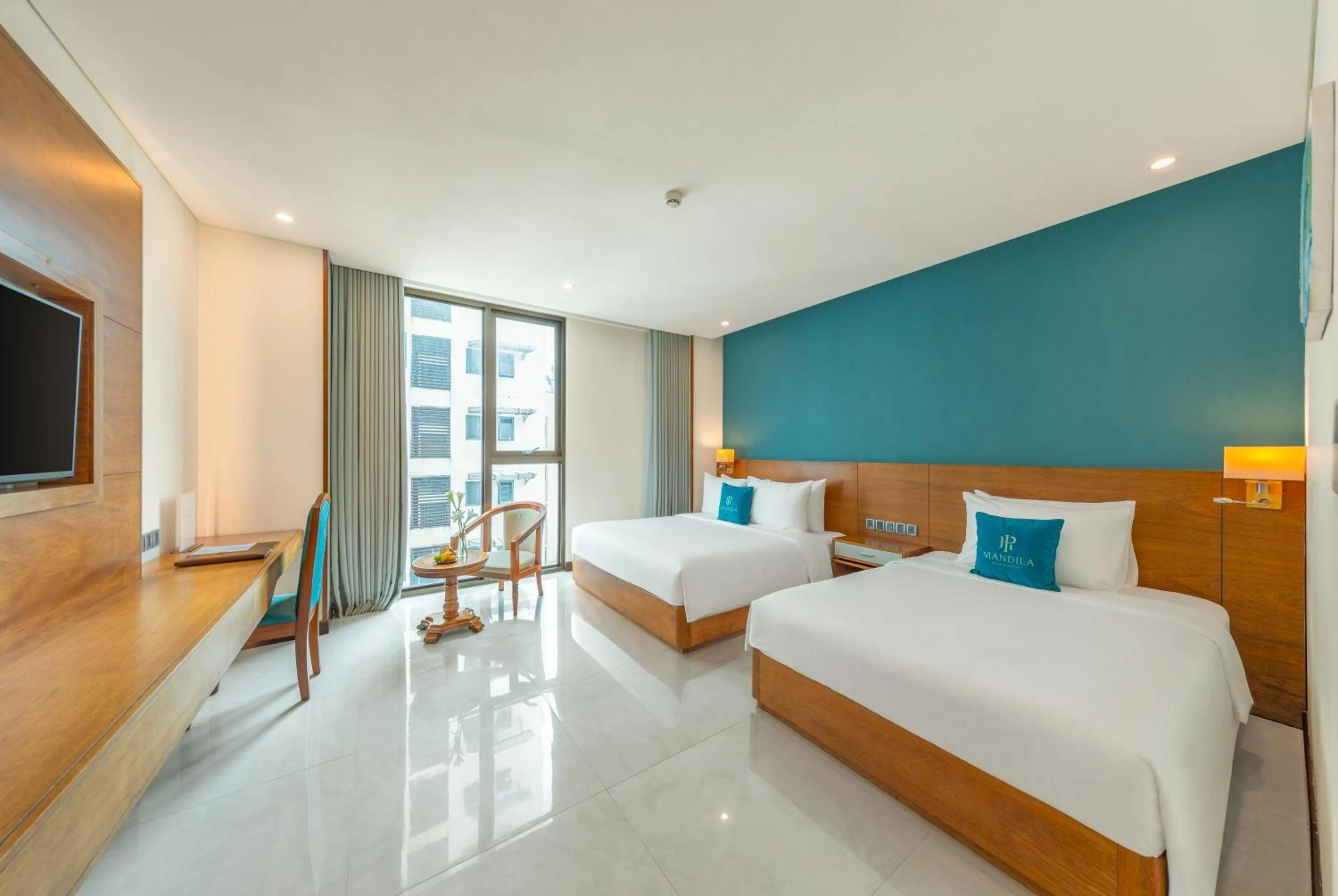 Photo of the whole room, Bed in Mandila Beach Hotel Danang