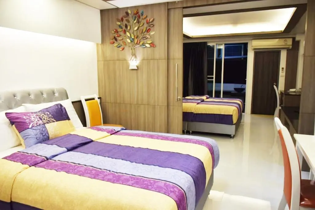 Property building, Bed in Family Suite Room Pratunam
