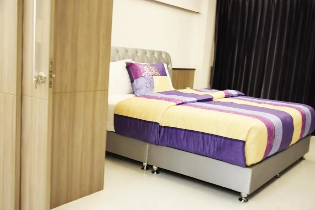 Property building, Bed in Family Suite Room Pratunam