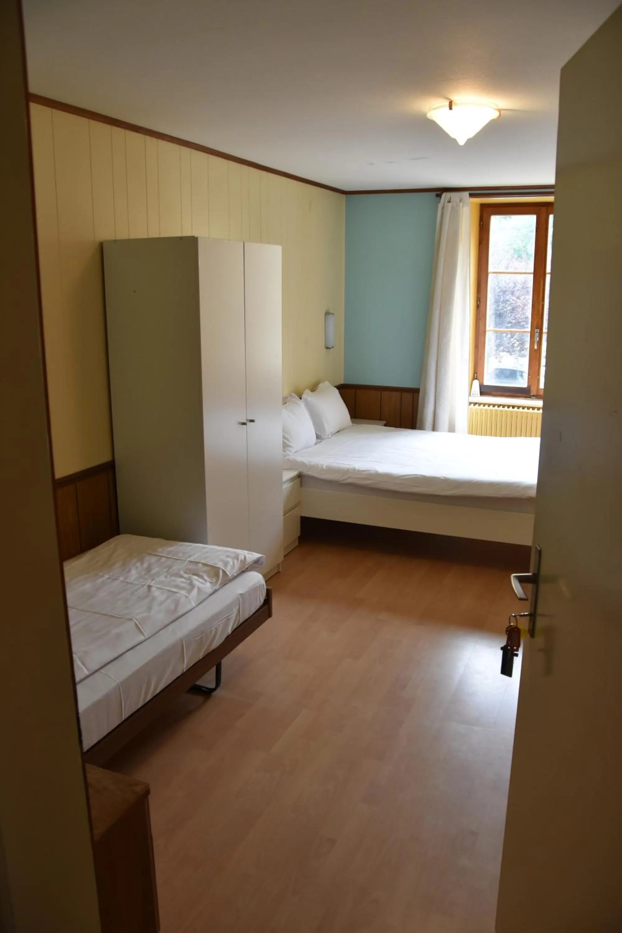 Bed in Hôtel de l'ours