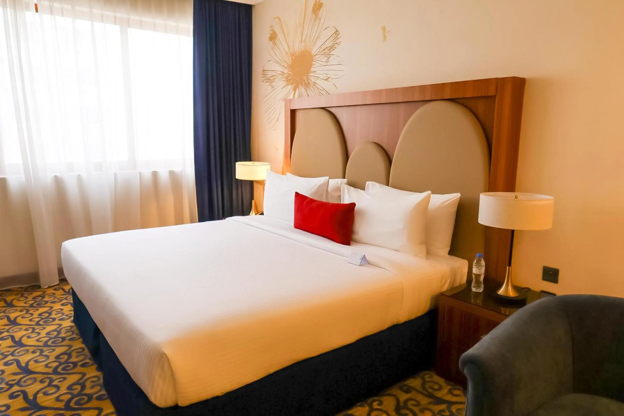 Bed in City Seasons Al Hamra Hotel