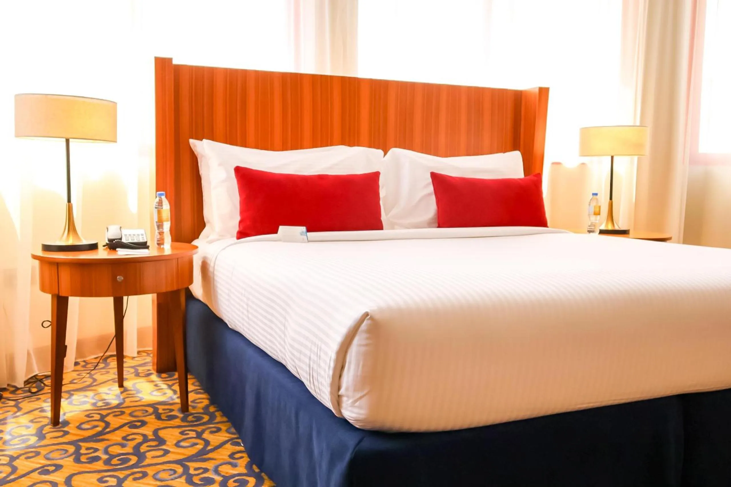 Bed in City Seasons Al Hamra Hotel