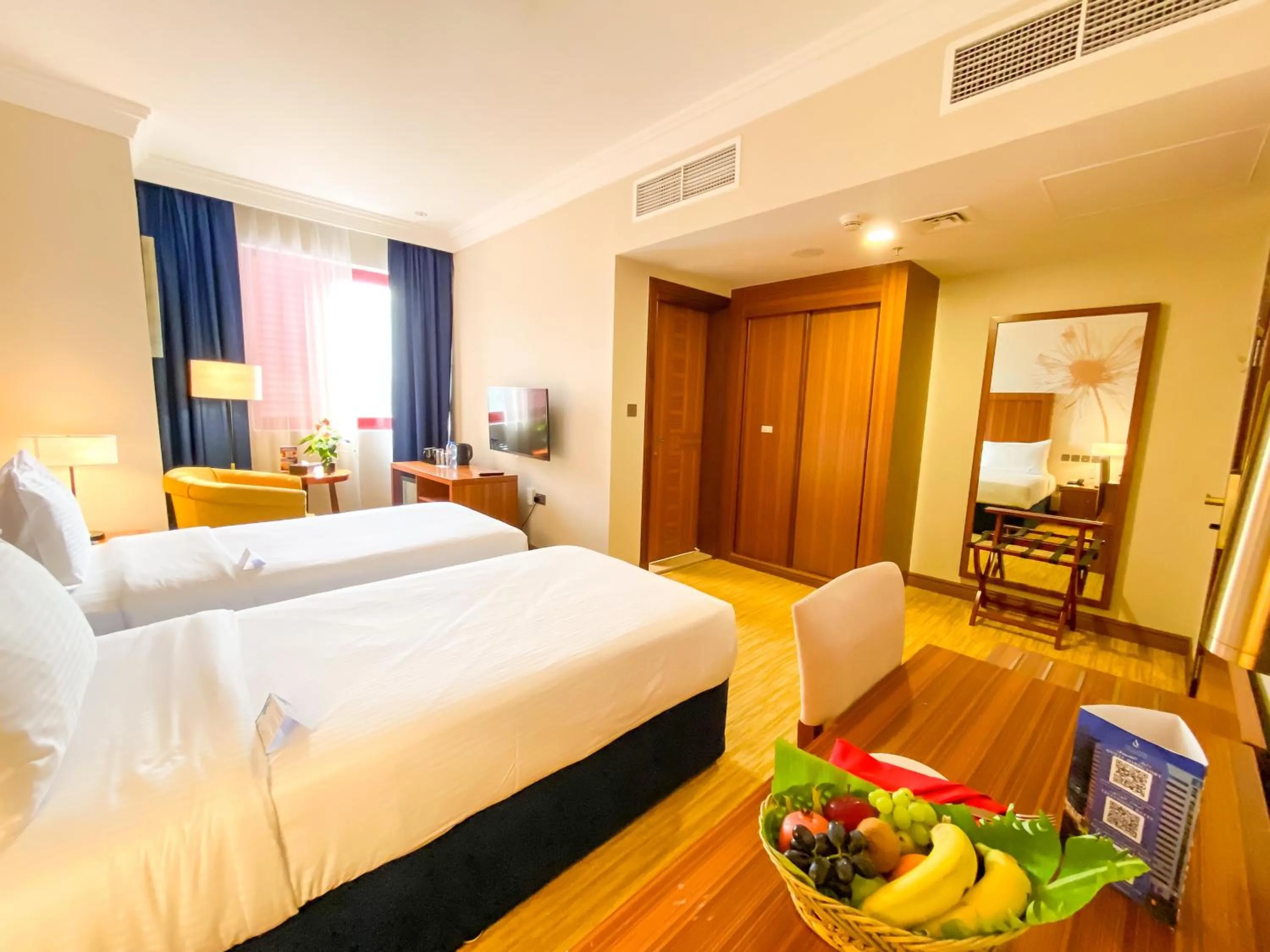 Bed in City Seasons Al Hamra Hotel