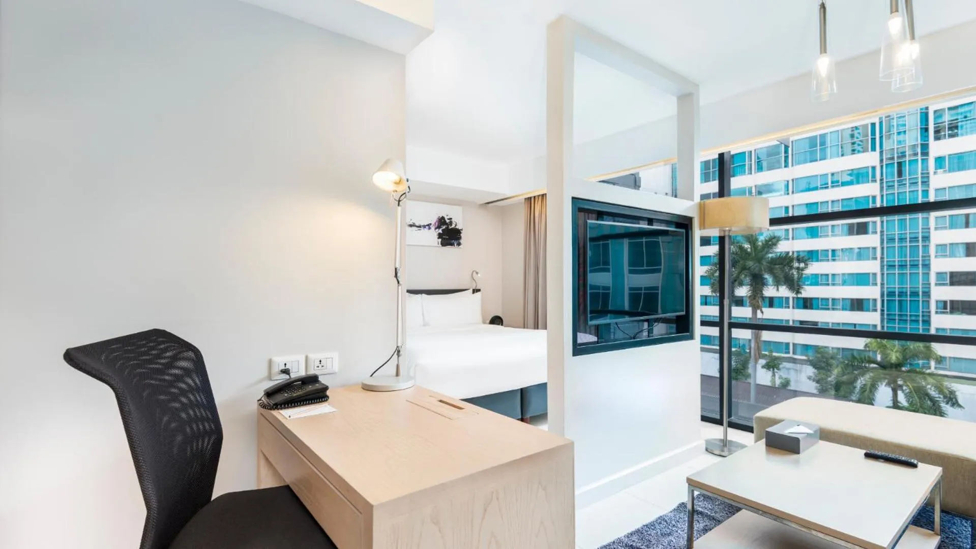 Living room in Maitria Hotel Sukhumvit 18 Bangkok – A Chatrium Collection