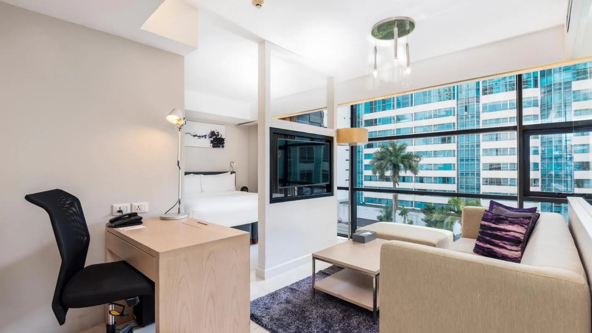 Living room in Maitria Hotel Sukhumvit 18 Bangkok – A Chatrium Collection