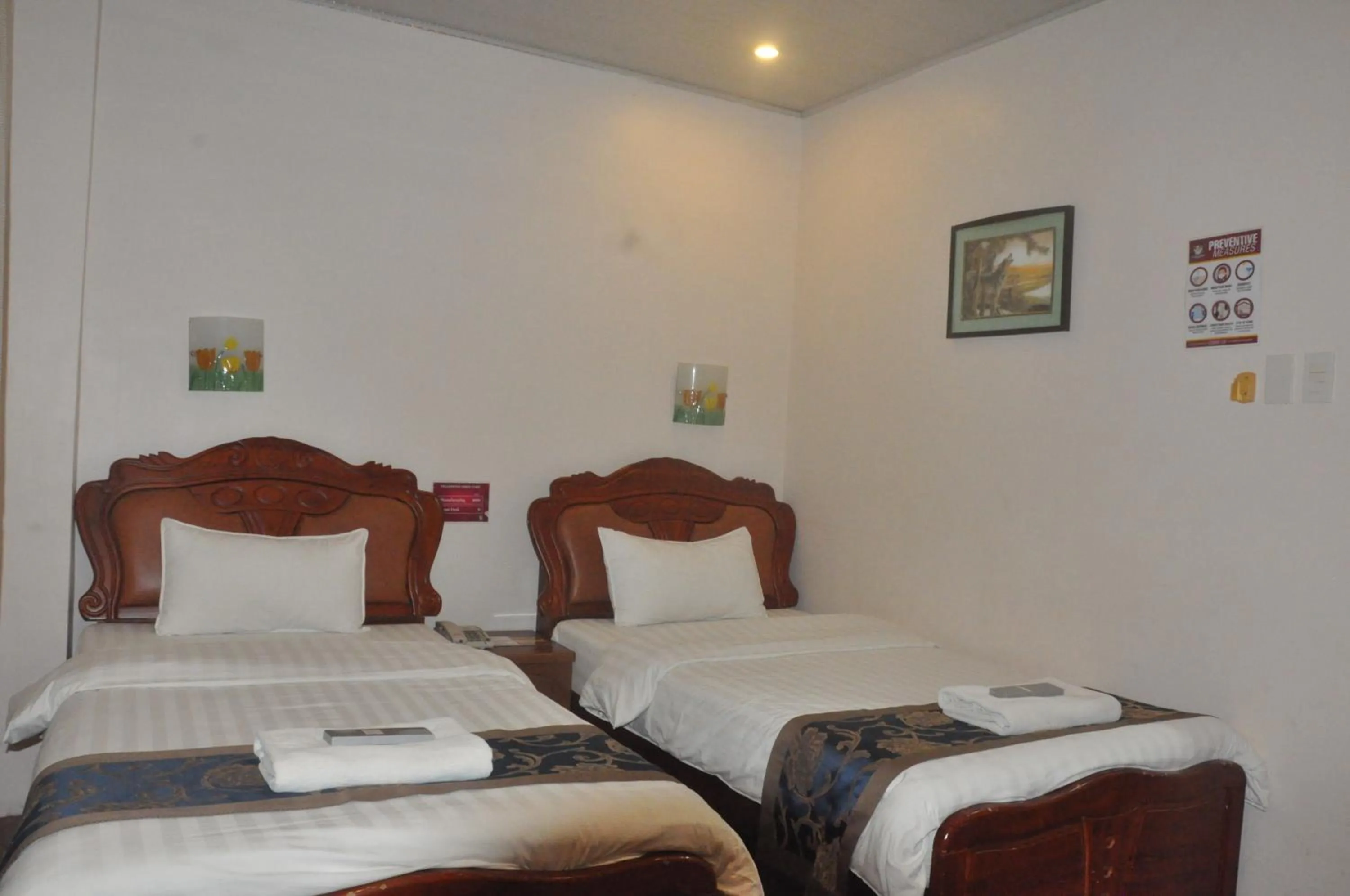 Bed in A&A Plaza Hotel