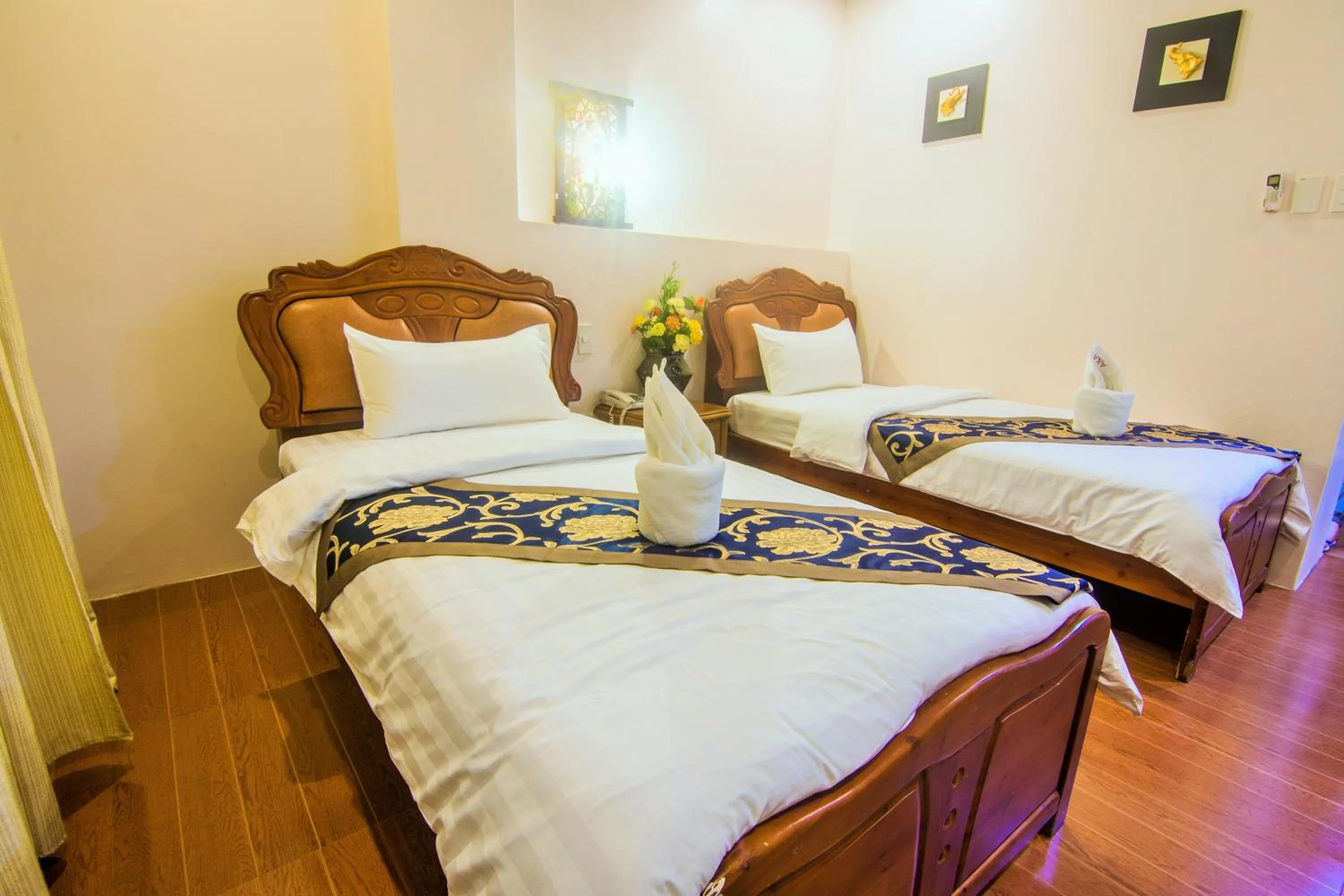 Bed in A&A Plaza Hotel