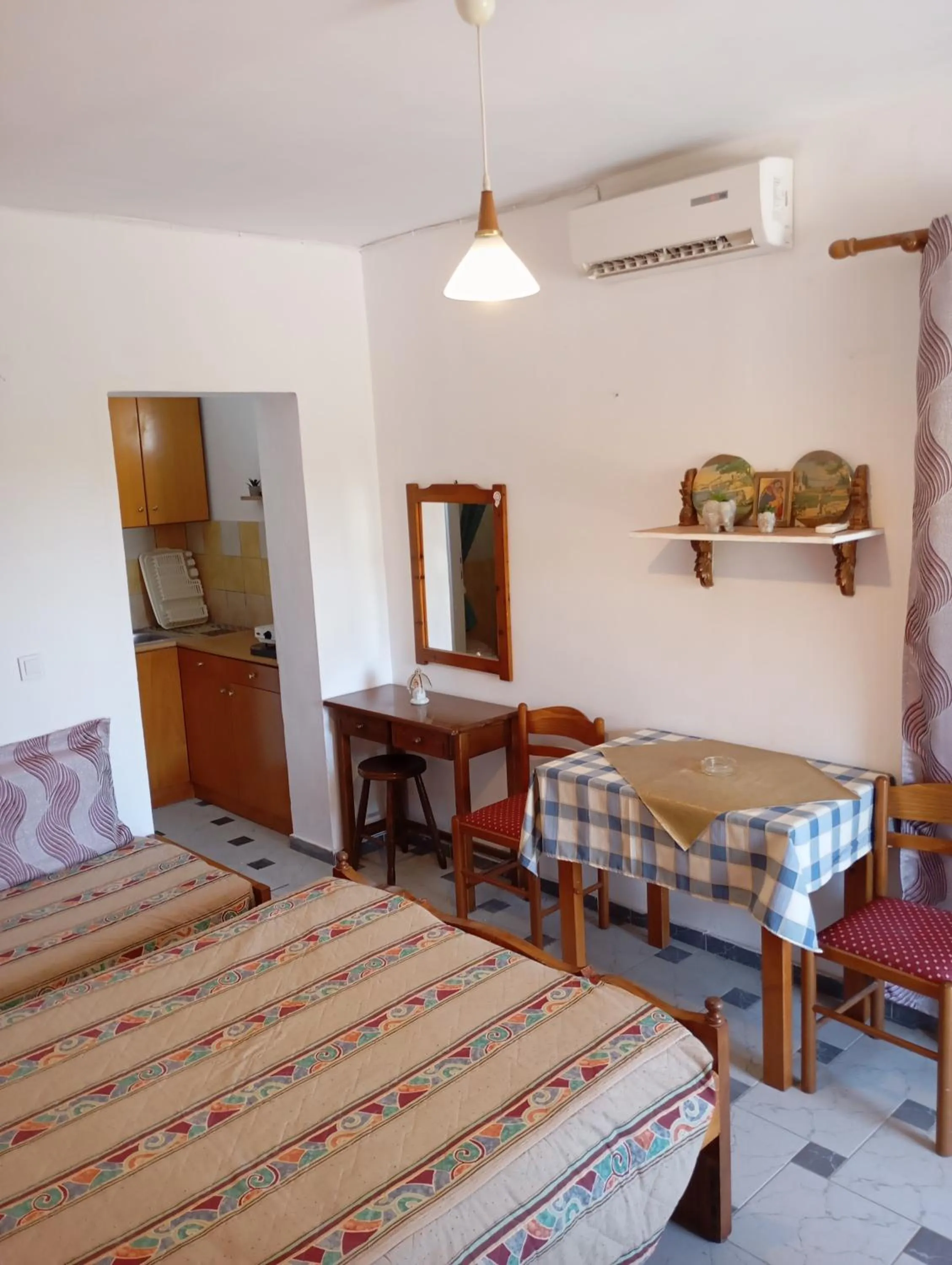 Bed in Denise Apartments Kefalos