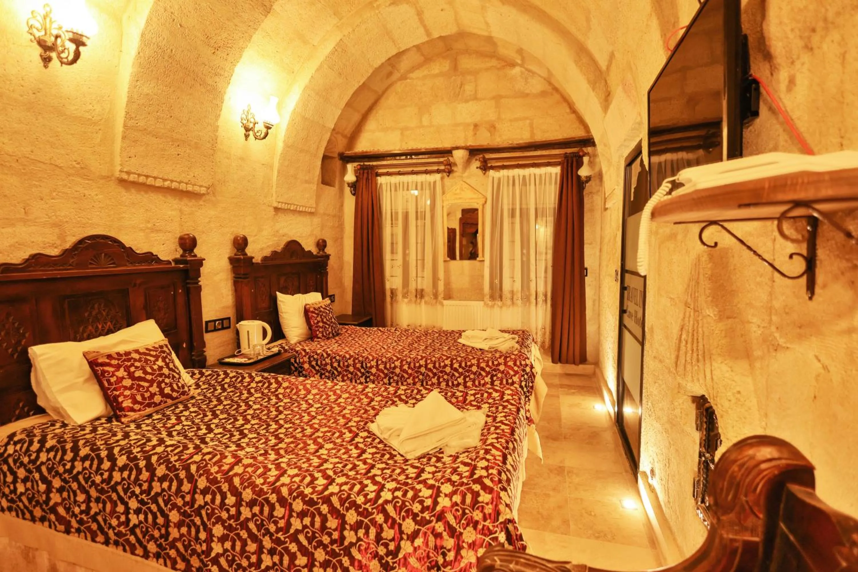 Bed in Travel Inn Cave Hotel