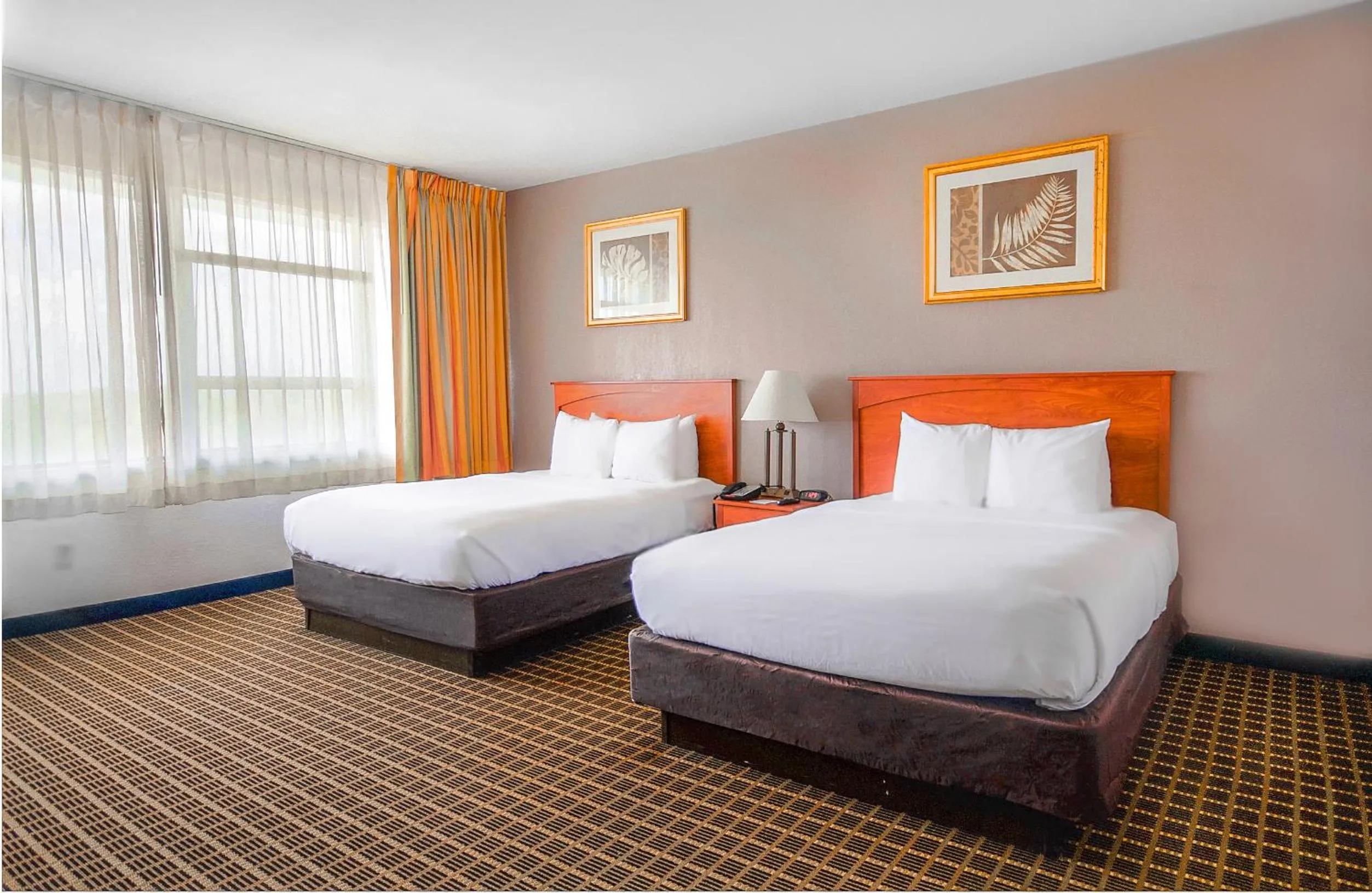 Bed in Clarion Inn & Suites Miami International Airport