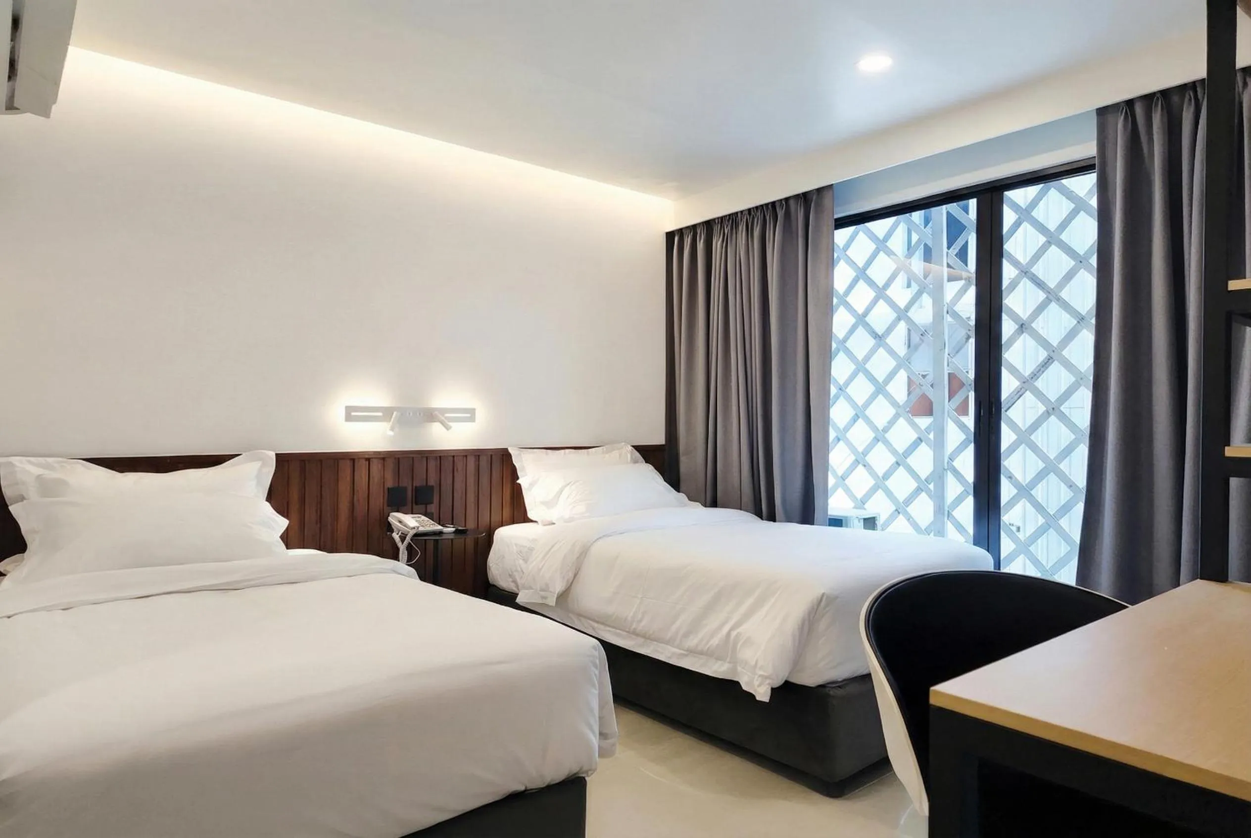 Bed in Grand Inn Hotel