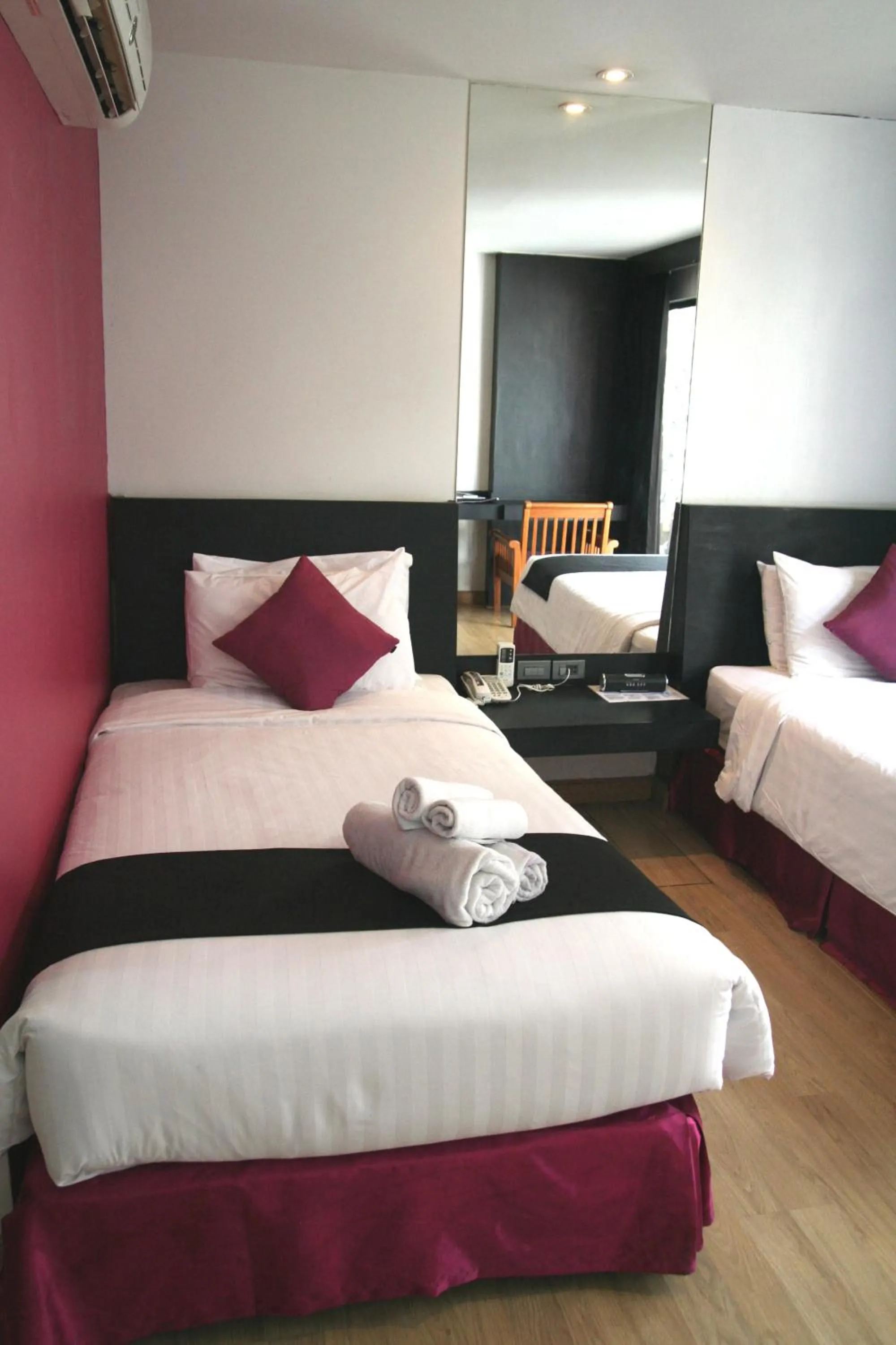 Bed in Grand Inn Hotel