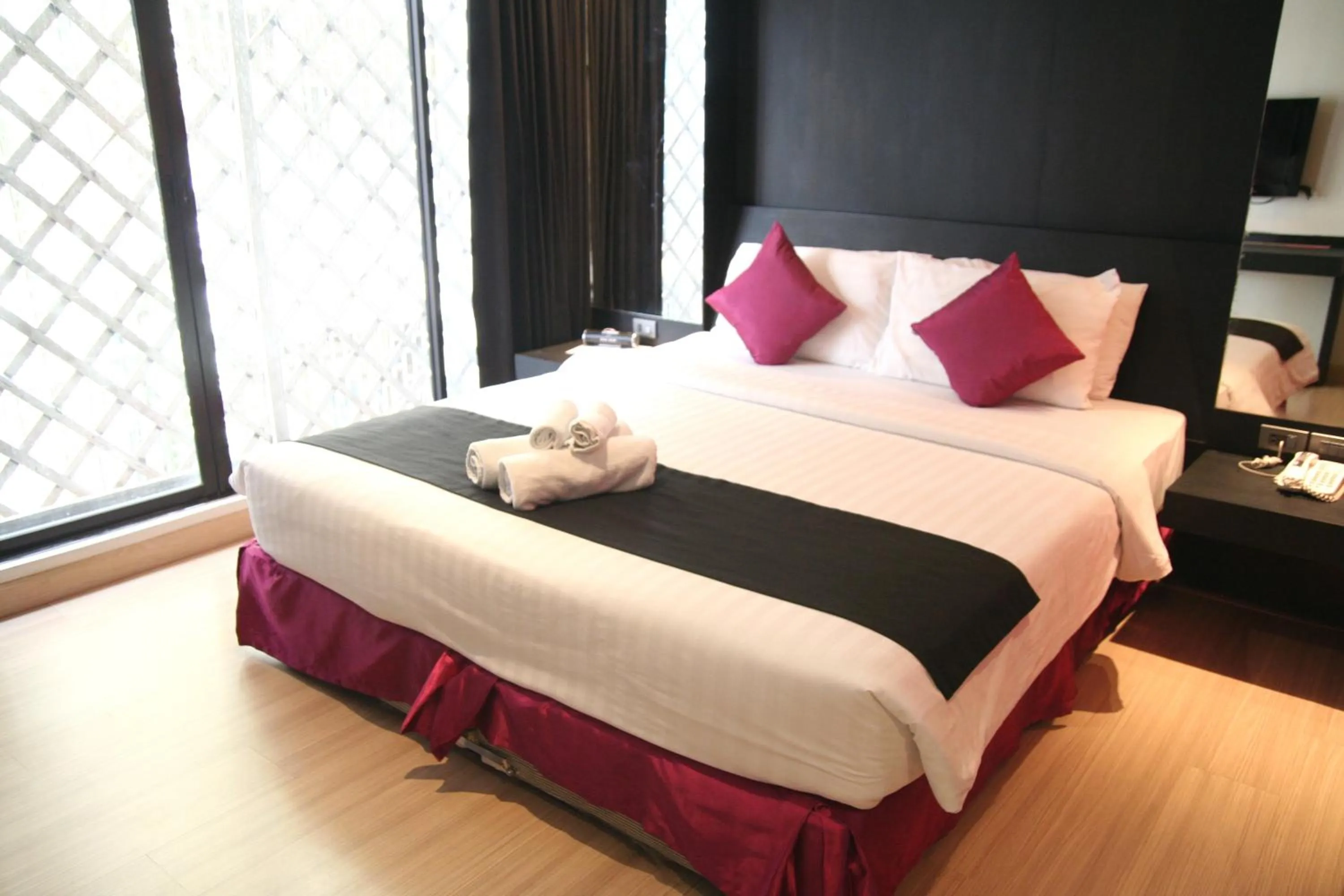 Bed in Grand Inn Hotel