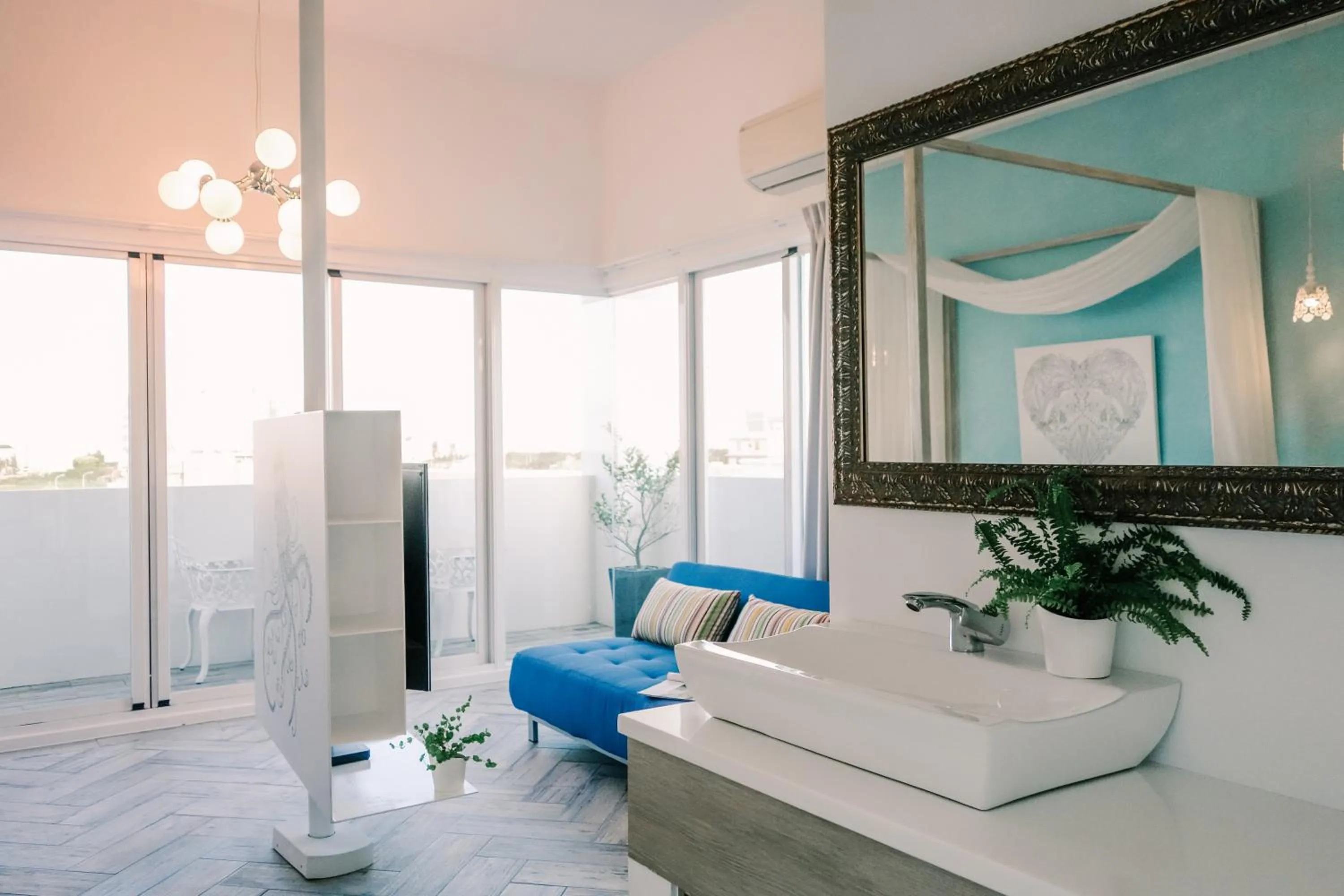 Living room, Bed in Color Coral Boutique Hotel