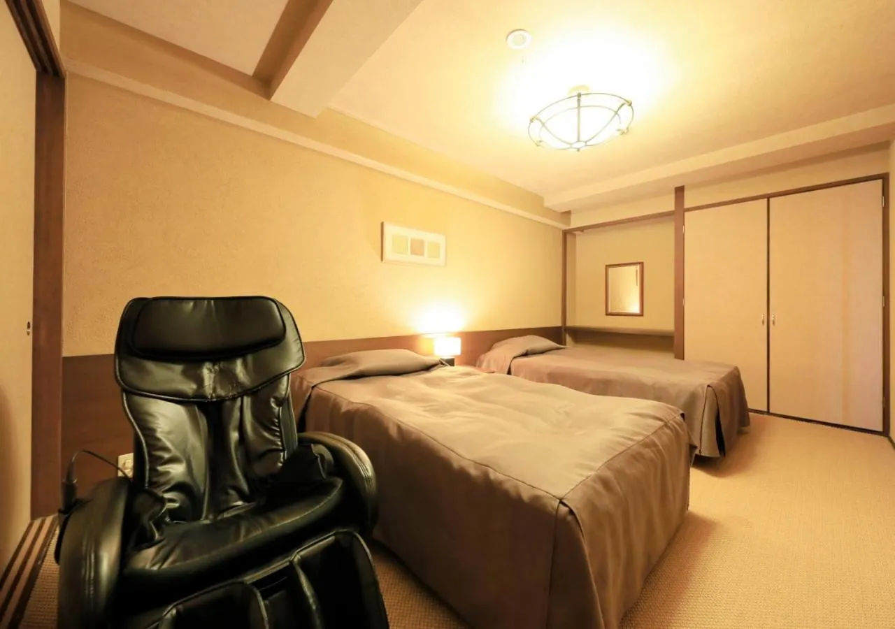 Bed in Katsuura Hilltop Hotel & Residence