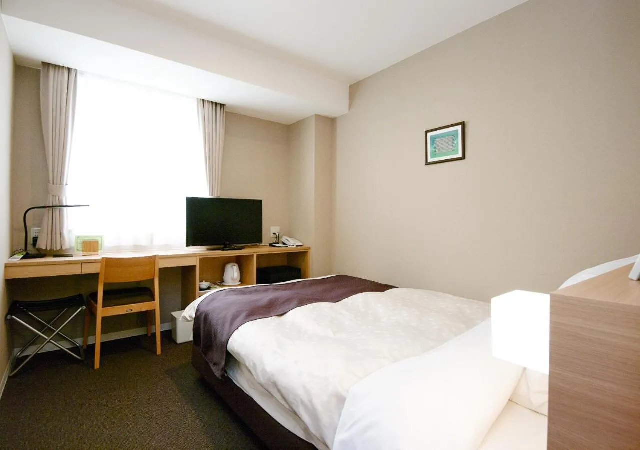 Bed in Shibetsu Grand Hotel