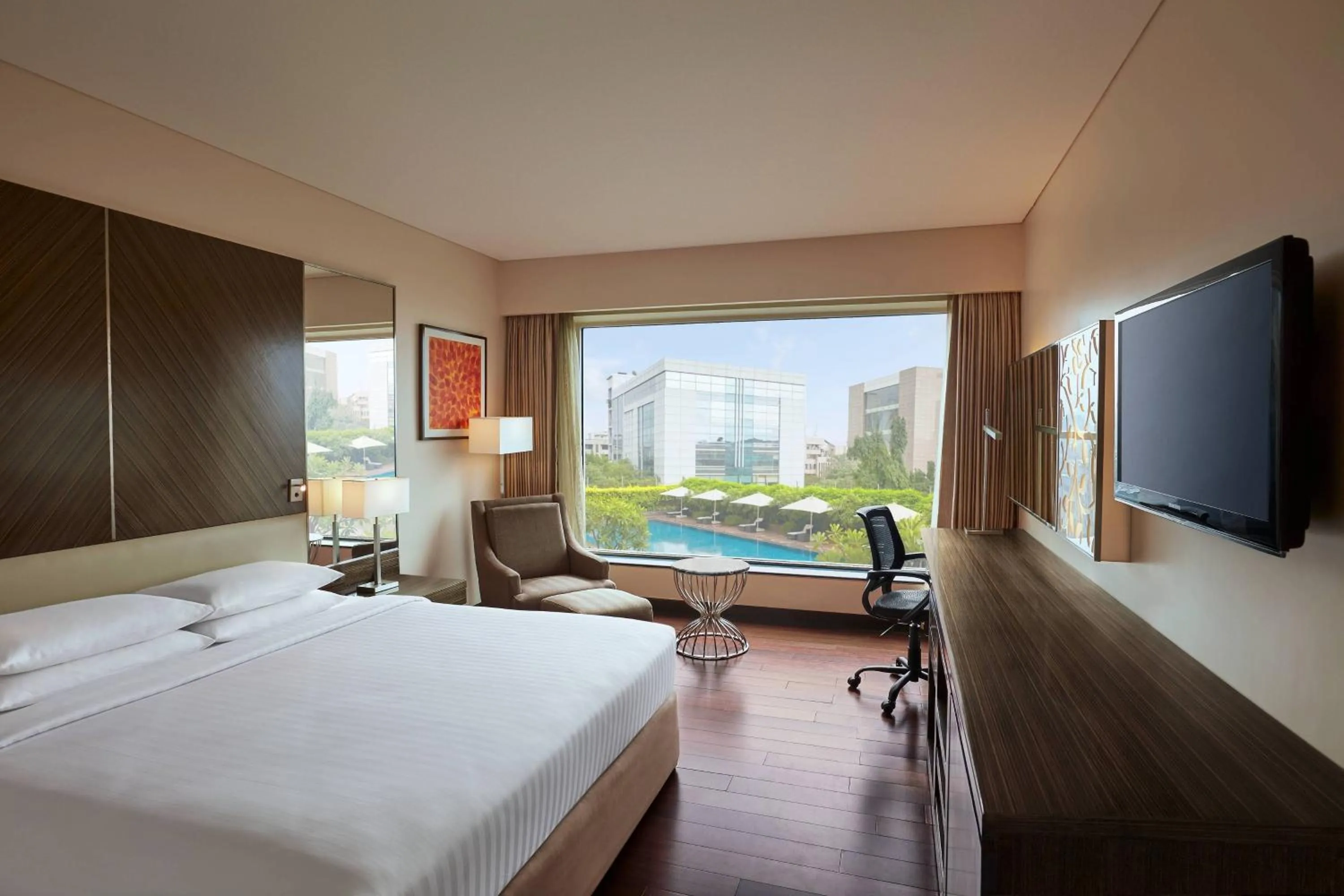Swimming pool, Bed in Courtyard by Marriott Mumbai International Airport
