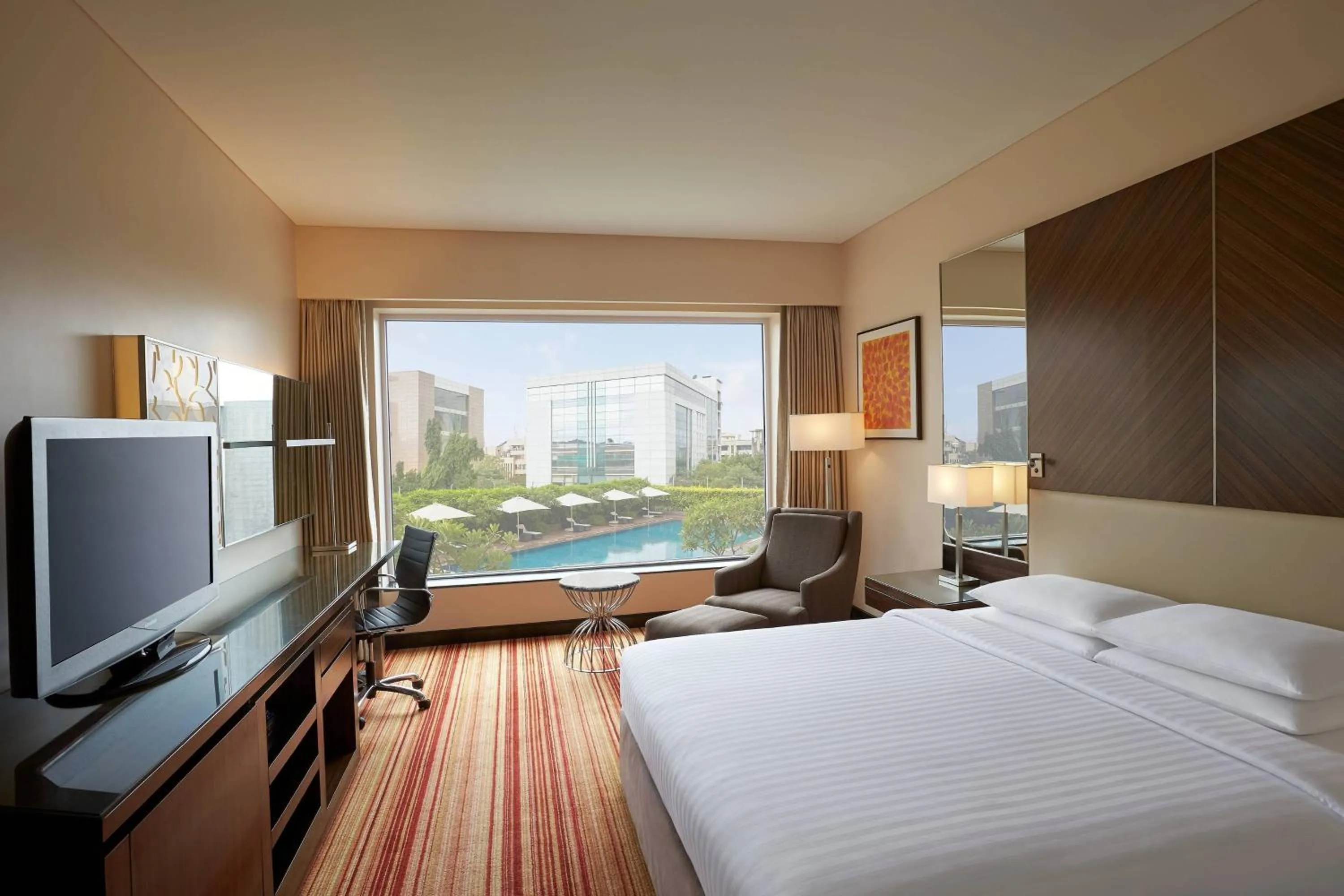 Swimming pool, Bed in Courtyard by Marriott Mumbai International Airport