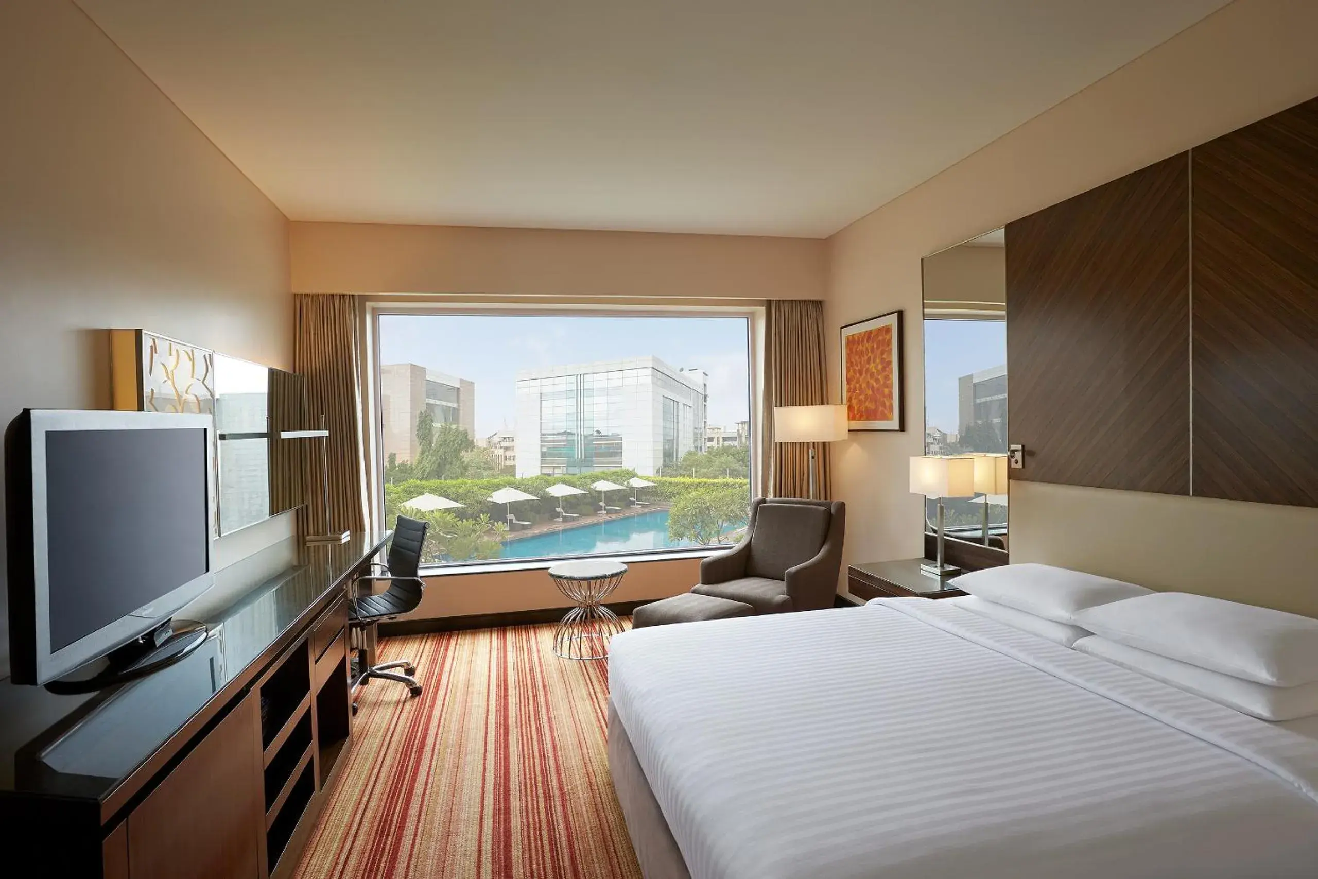 Deluxe King Room with Pool View - 15% off on Spa and 20% off on Laundry in Courtyard by Marriott Mumbai International Airport Deluxe King Room with Pool View - 15% off on Spa and 20% off on Laundry in Courtyard by Marriott Mumbai International Airport